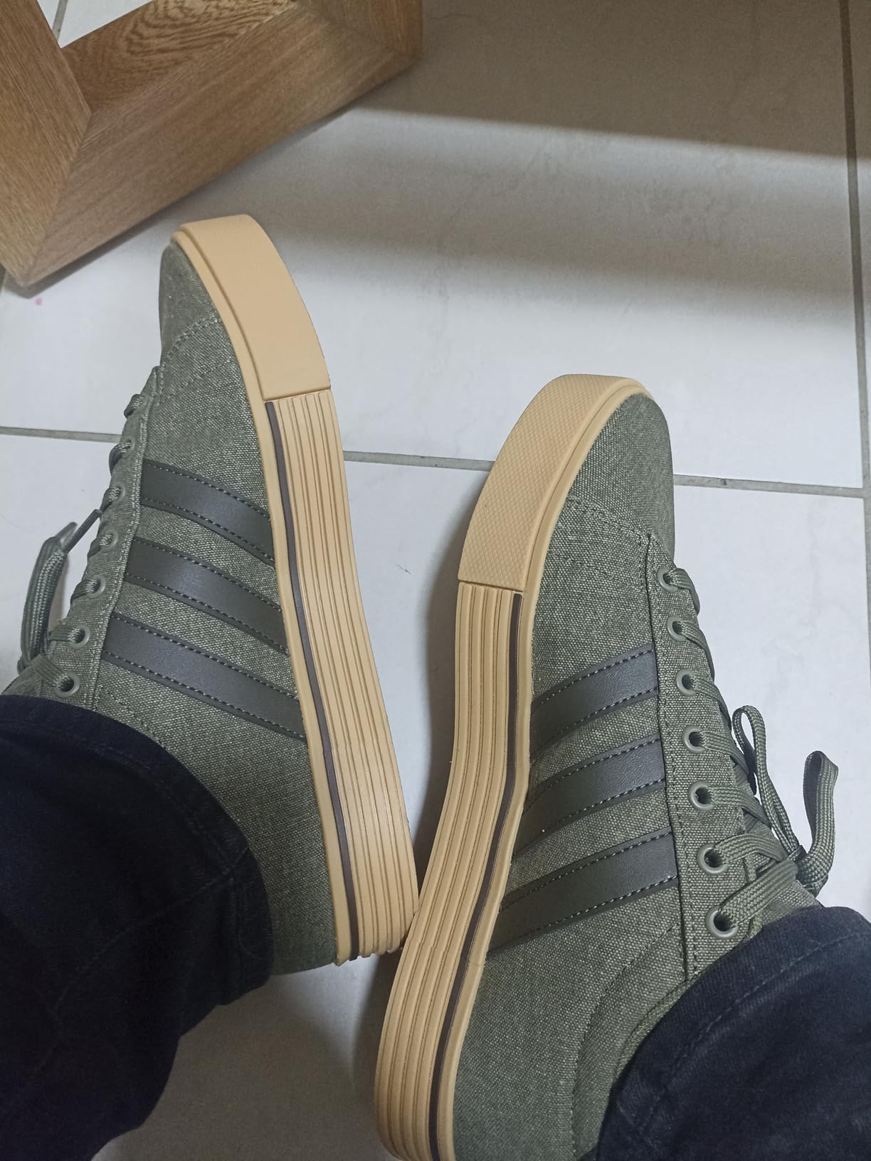 Adidas Daily 4.0 sneakers worn in casual lifestyle setting showing versatility with jeans