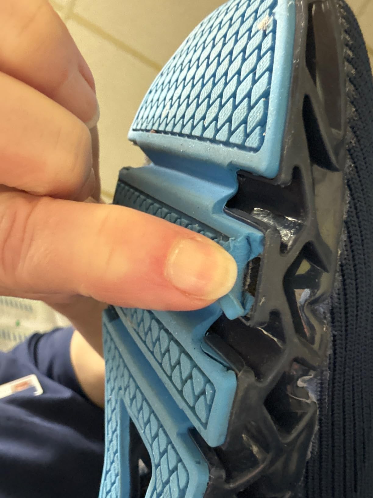 Close-up showing SKDOIUL shoe sole peeling and separation from upper