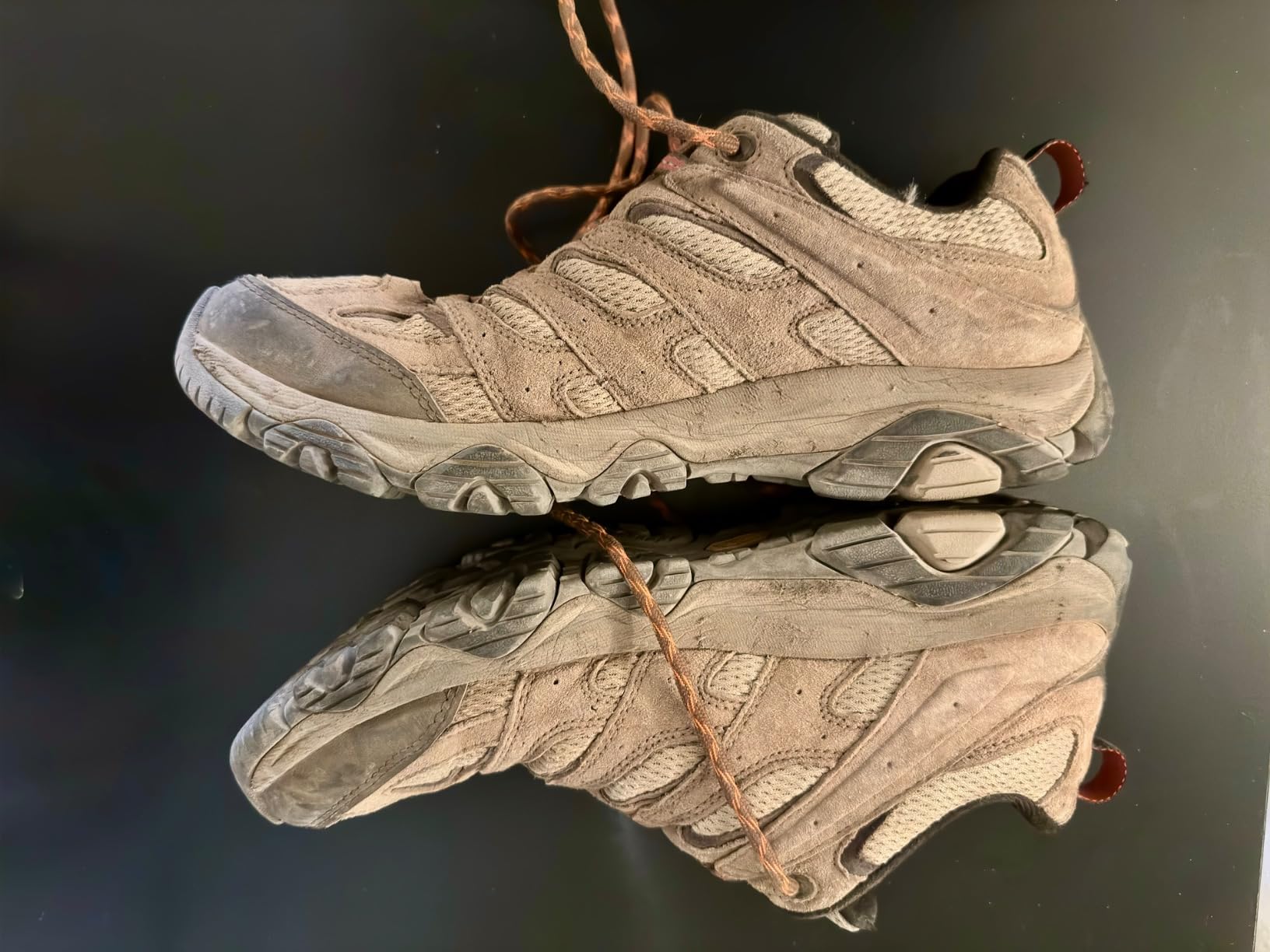 Merrell Men's Moab 3 Waterproof hiking shoes showing boulder colorway and Vibram sole design