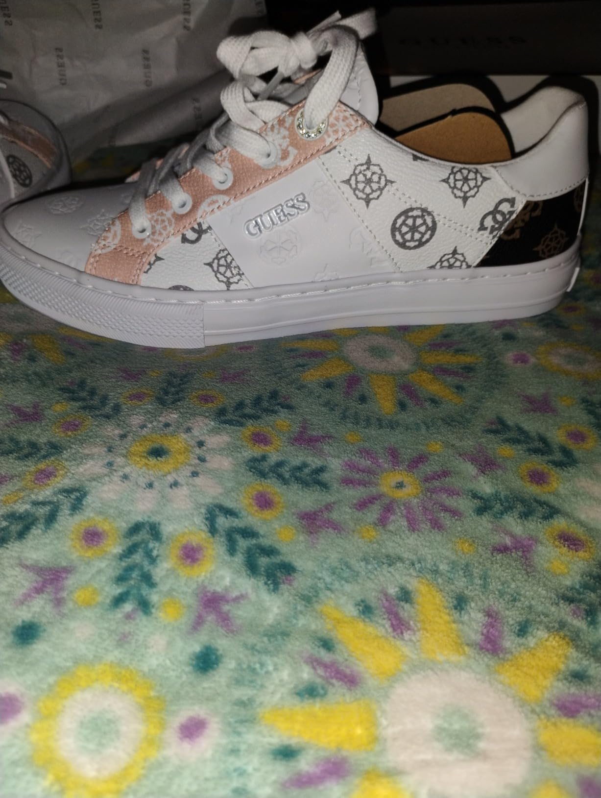 GUESS Women's Loven Sneaker lifestyle shot showing versatile styling with different outfits