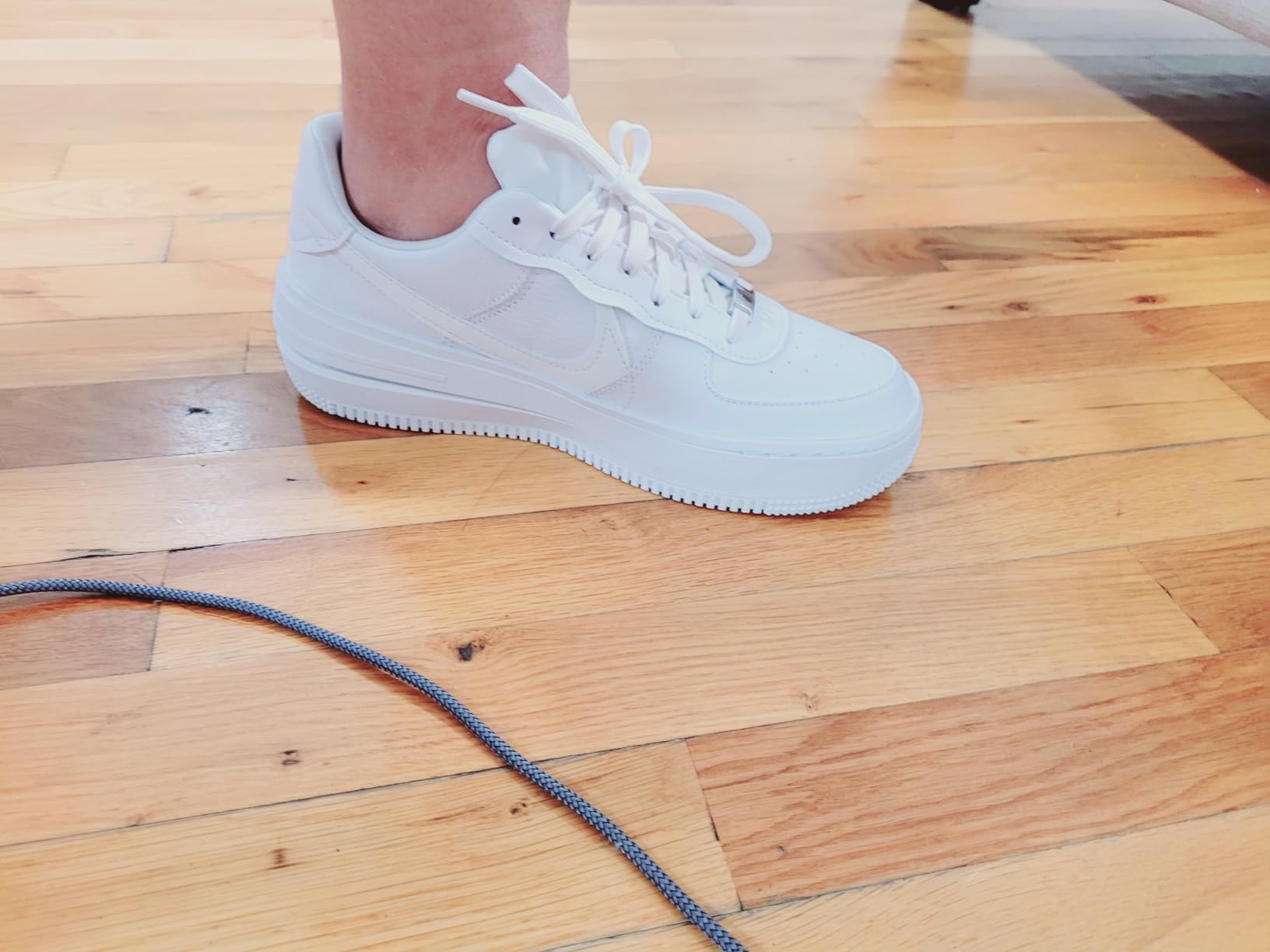 Nike Air Force 1 women's sneaker side profile showing leather upper construction and distinctive sole design