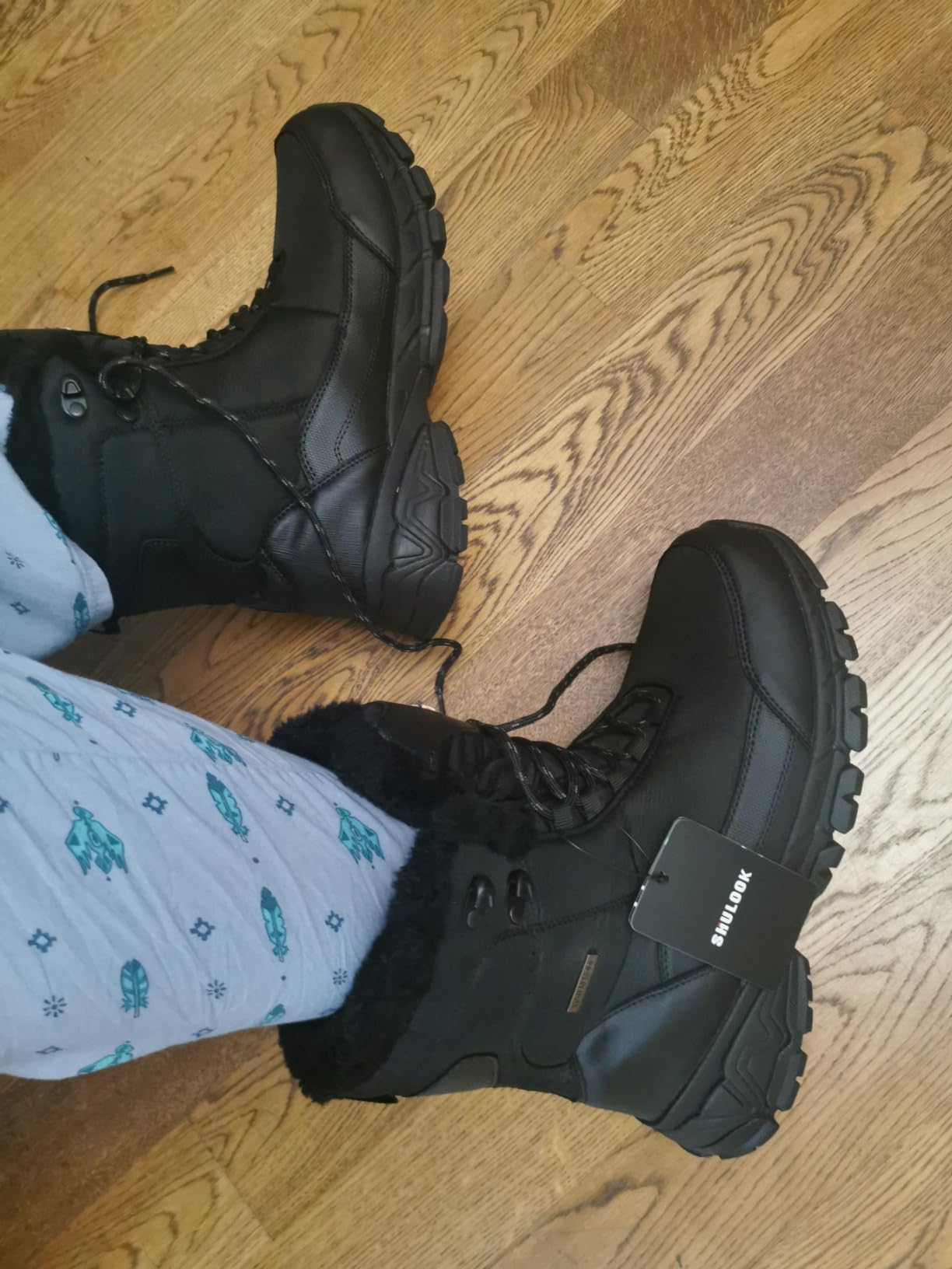 SHULOOK boots being tested in deep snow showing ankle support and waterproof design