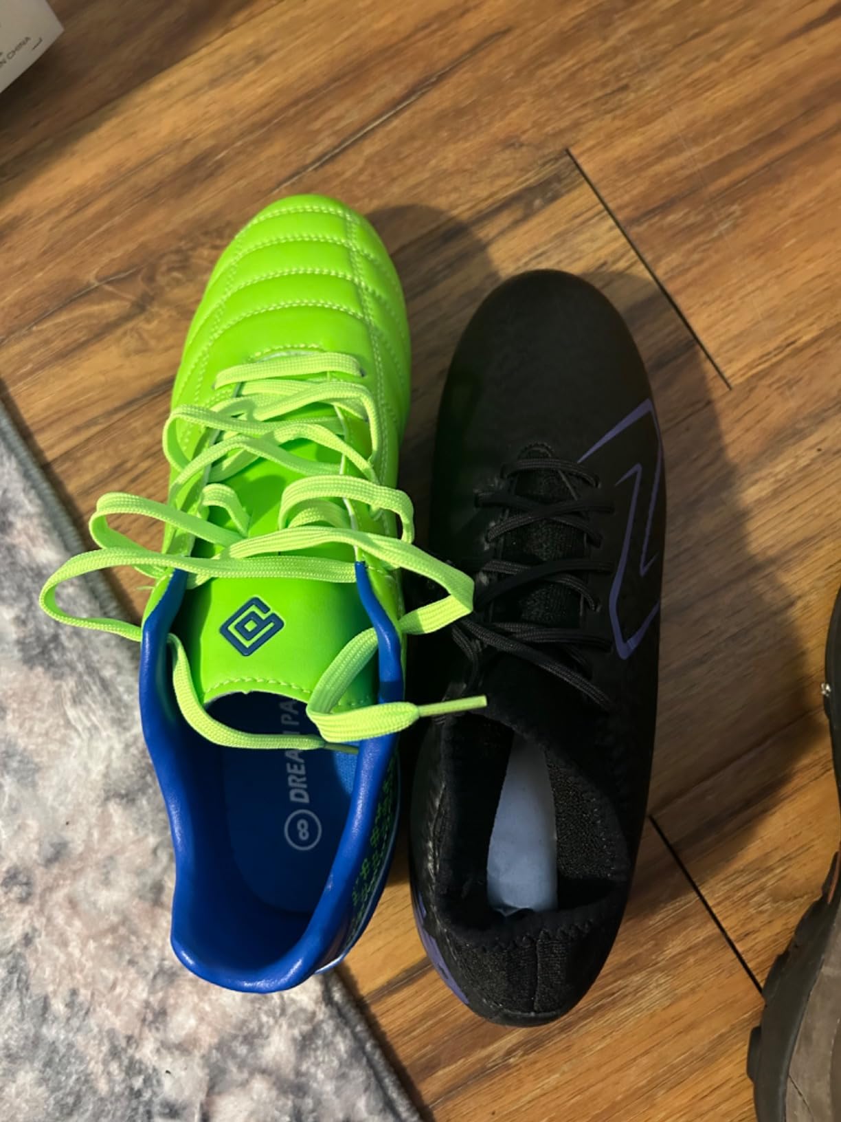 Comparison photo showing DREAM PAIRS wide toe box versus narrow New Balance cleats