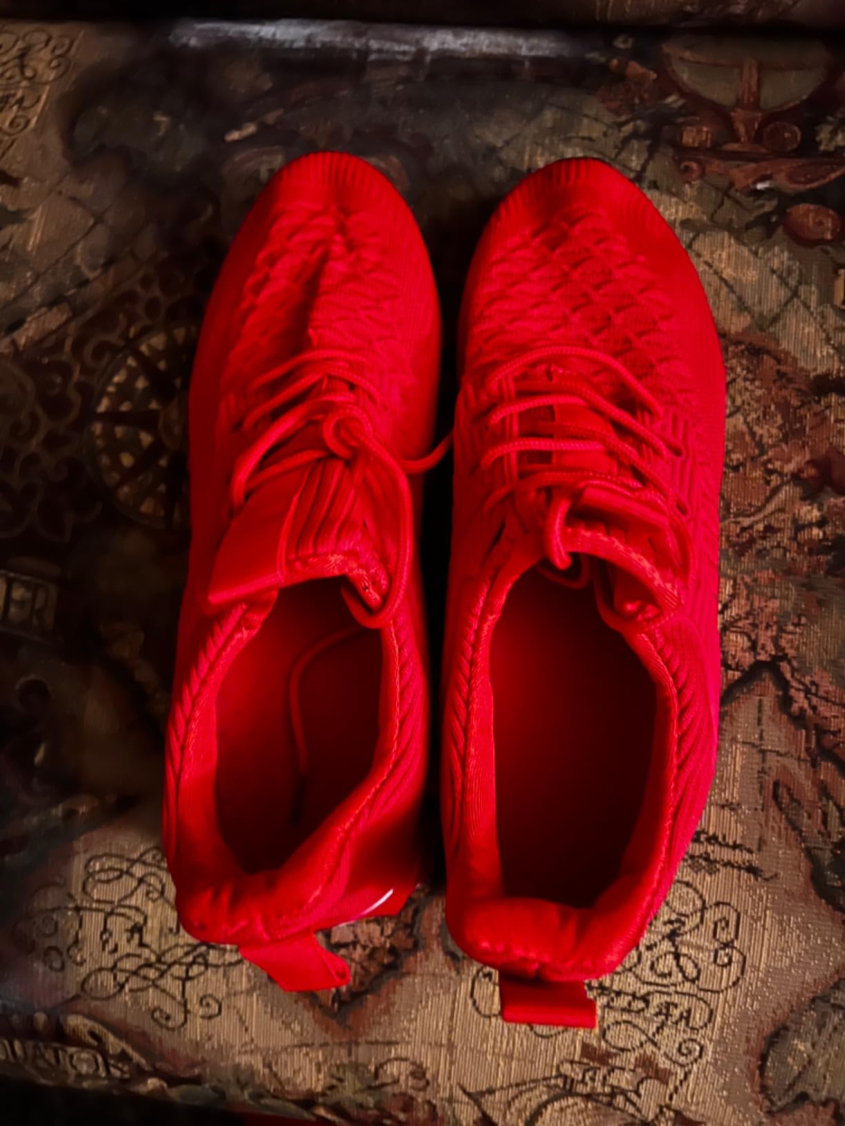 Red colorway men's blade shoes showing wear after extended testing period