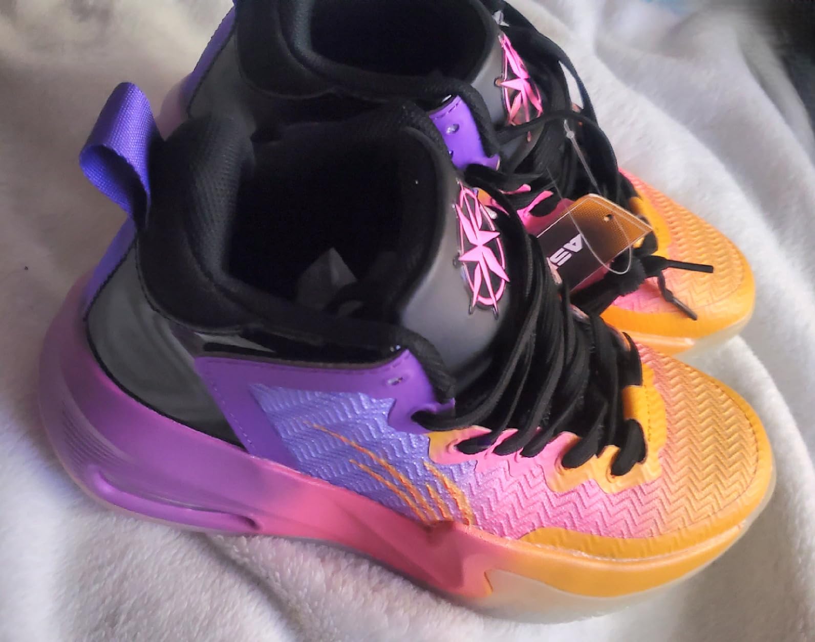 ASHION basketball shoes design details showing PU upper material and colorful gradient pattern
