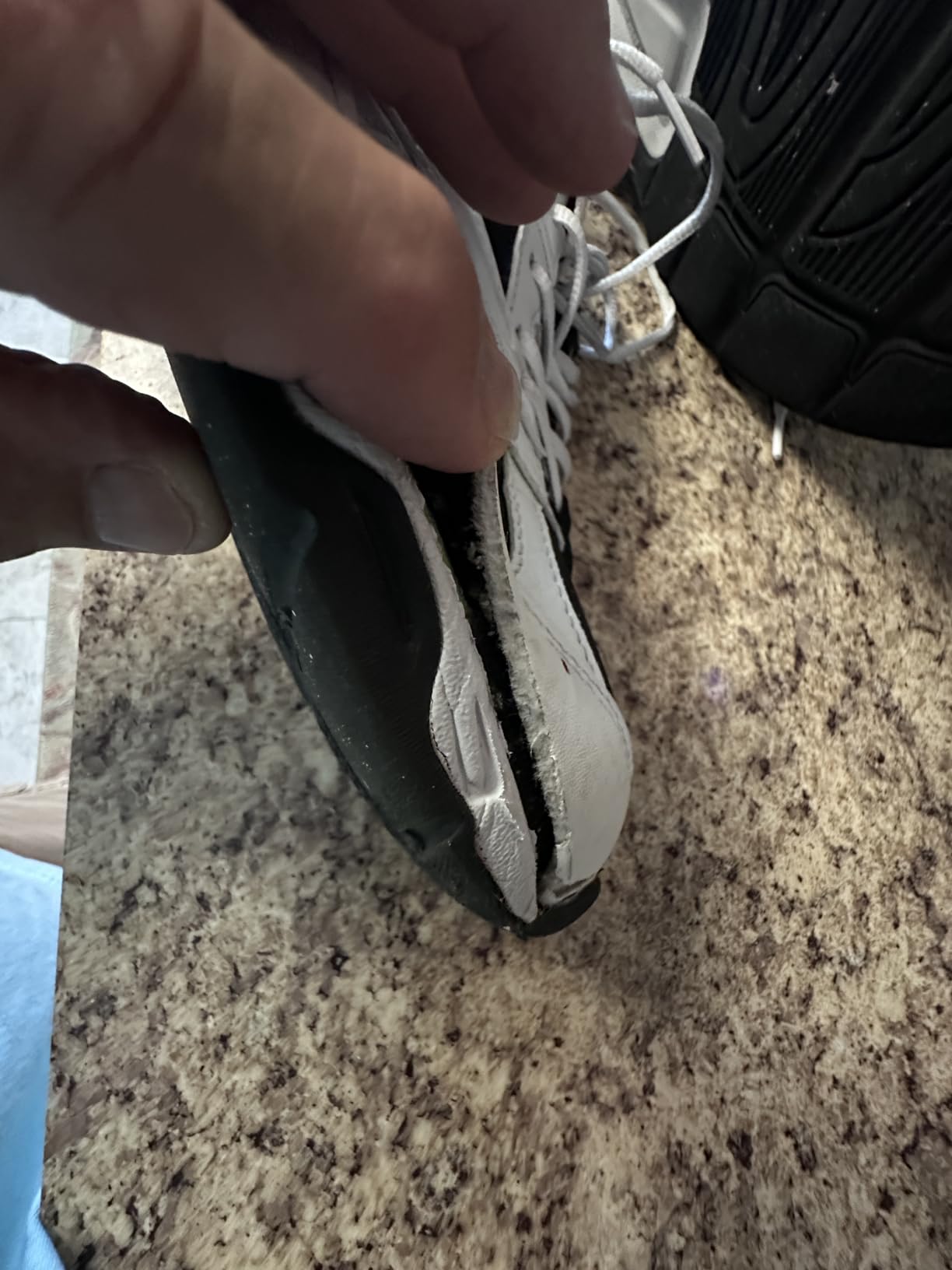 Avia sneaker showing early wear signs and side panel separation after limited use