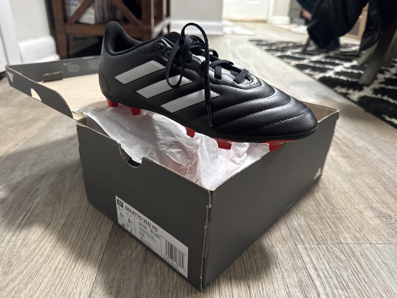 Close-up of Adidas Goletto VII synthetic upper material and stitching construction details