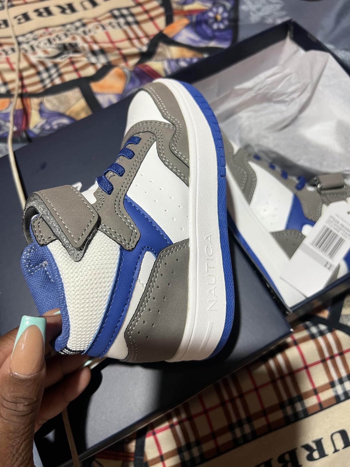 Close-up view of Nautica Horizon sneakers showing mesh upper construction and high-top ankle design