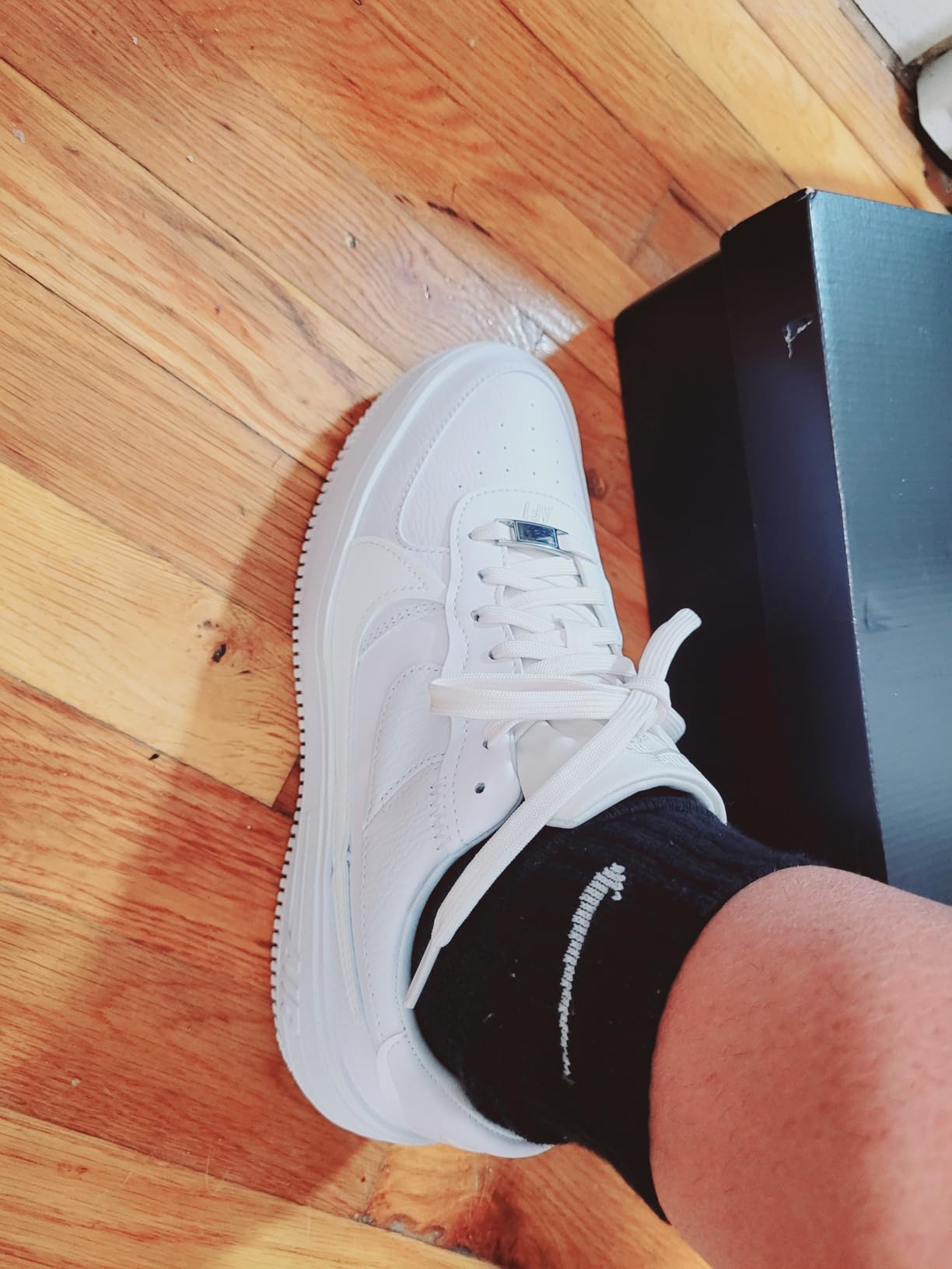 Nike Air Force 1 showing lace-up closure system and Nike swoosh branding details