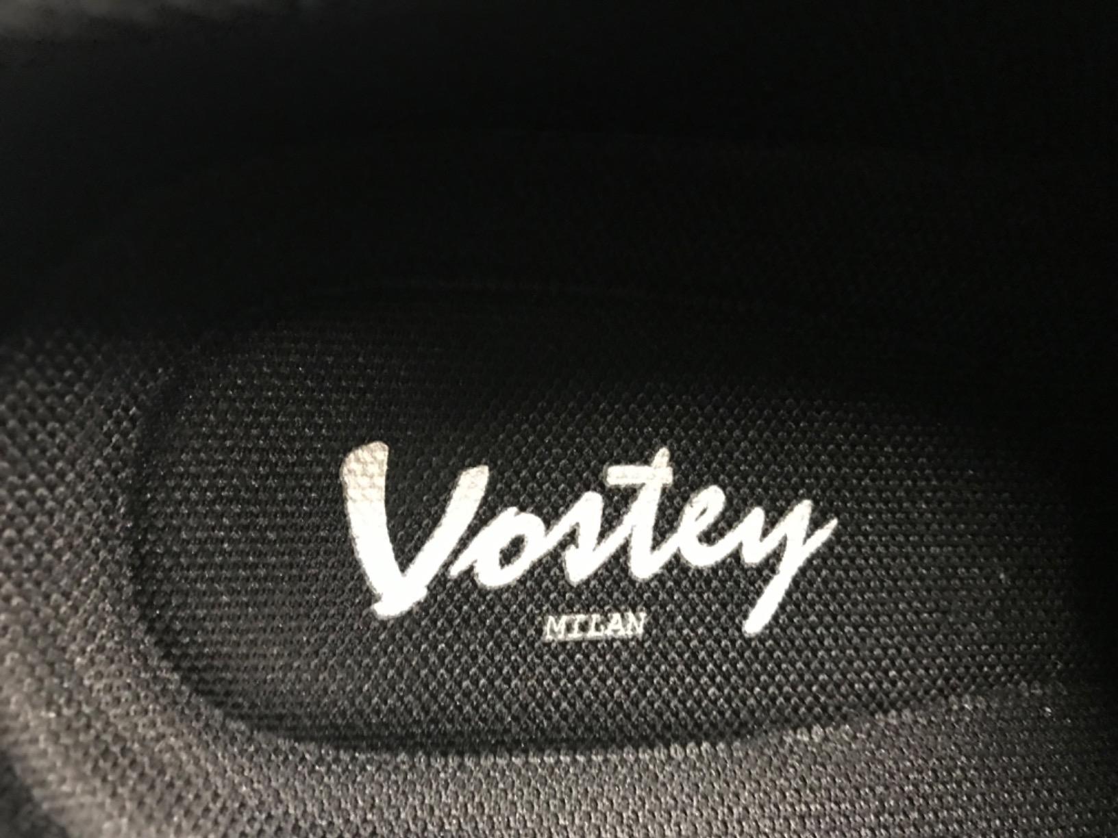 Vostey sneaker packaging and product showing advertised features versus actual construction quality