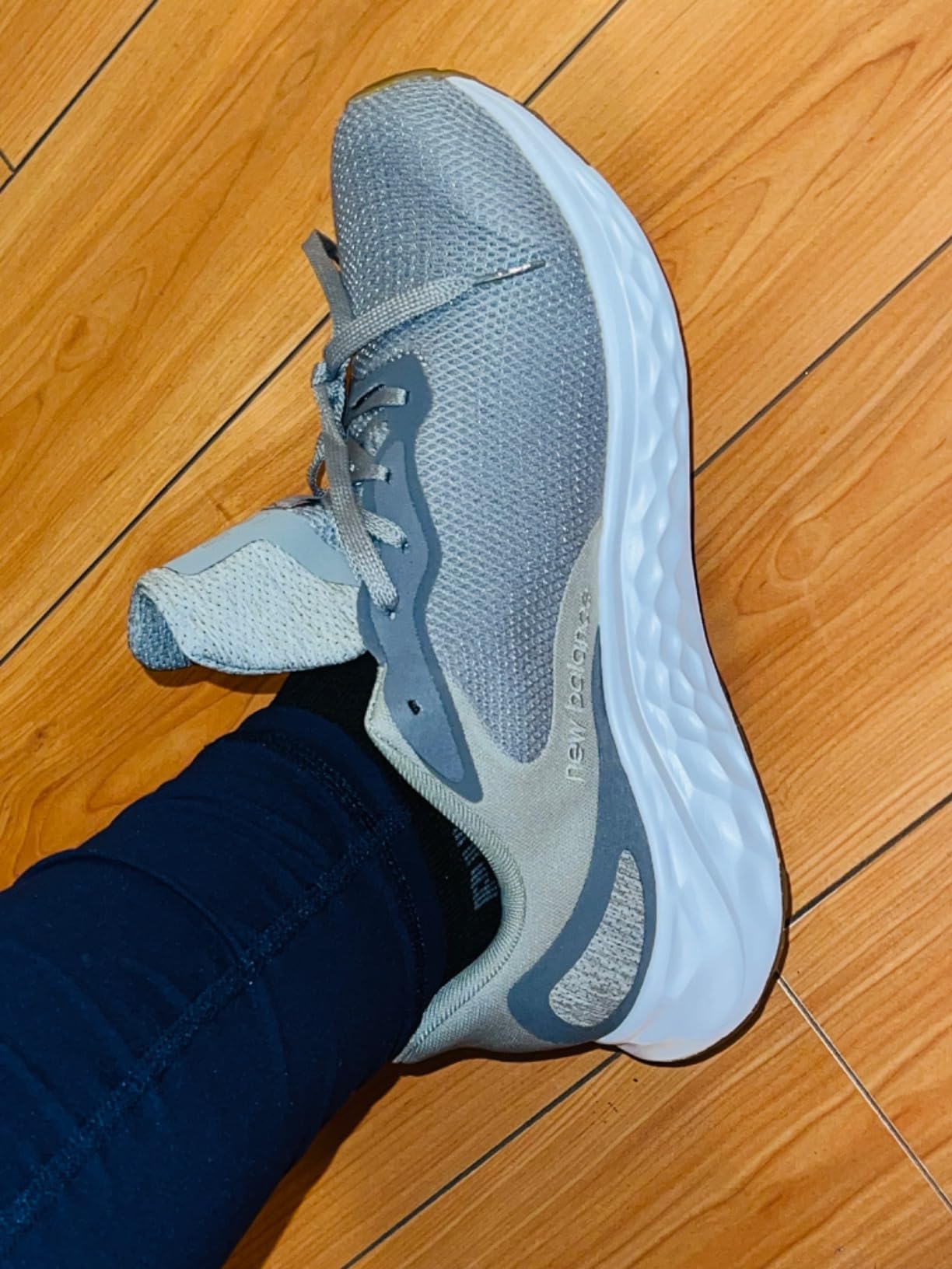 New Balance Arishi V4 action shot during outdoor running showing tread pattern performance