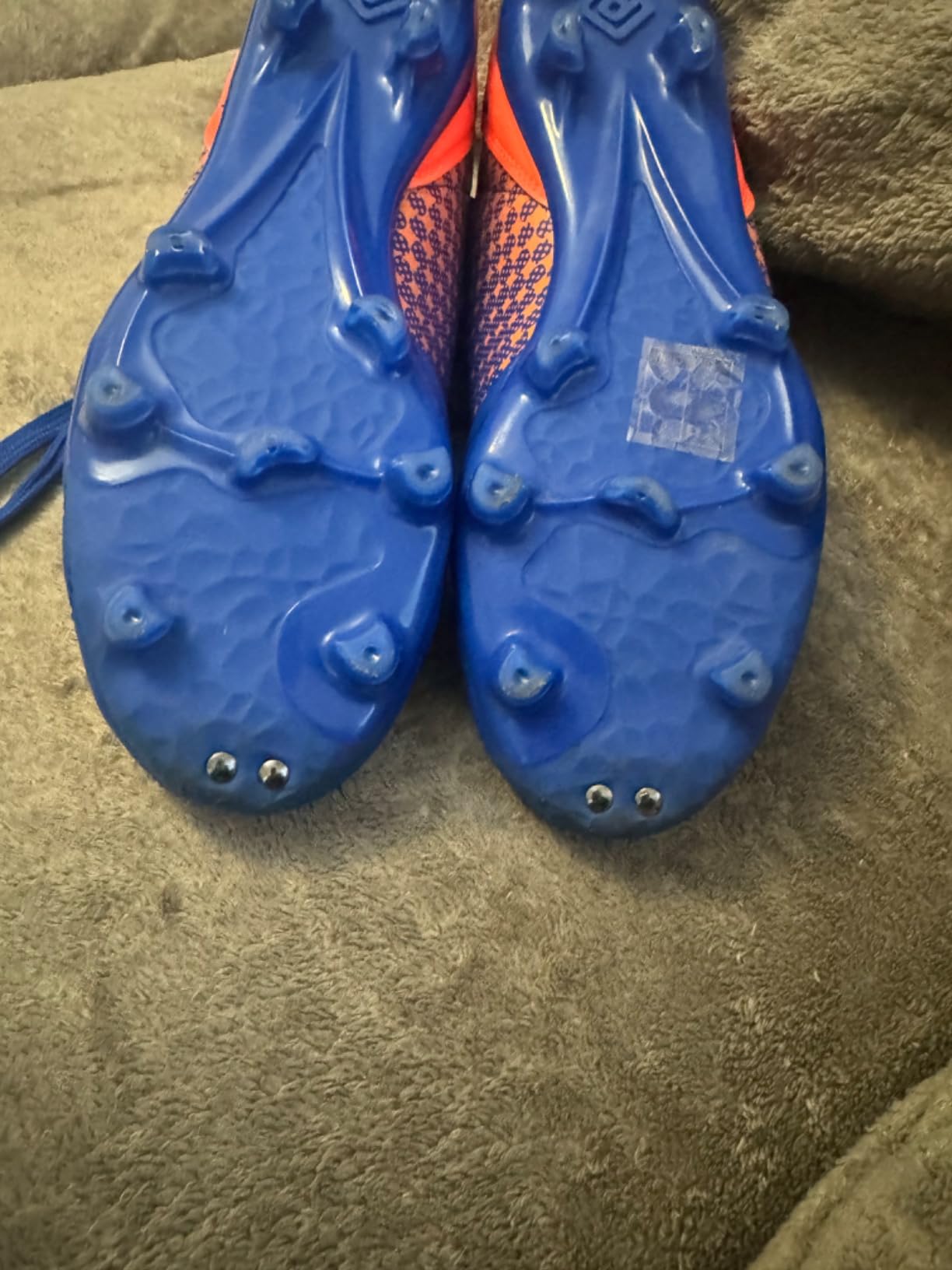 DREAM PAIRS soccer cleats showing synthetic PVC upper construction and lacing system detail