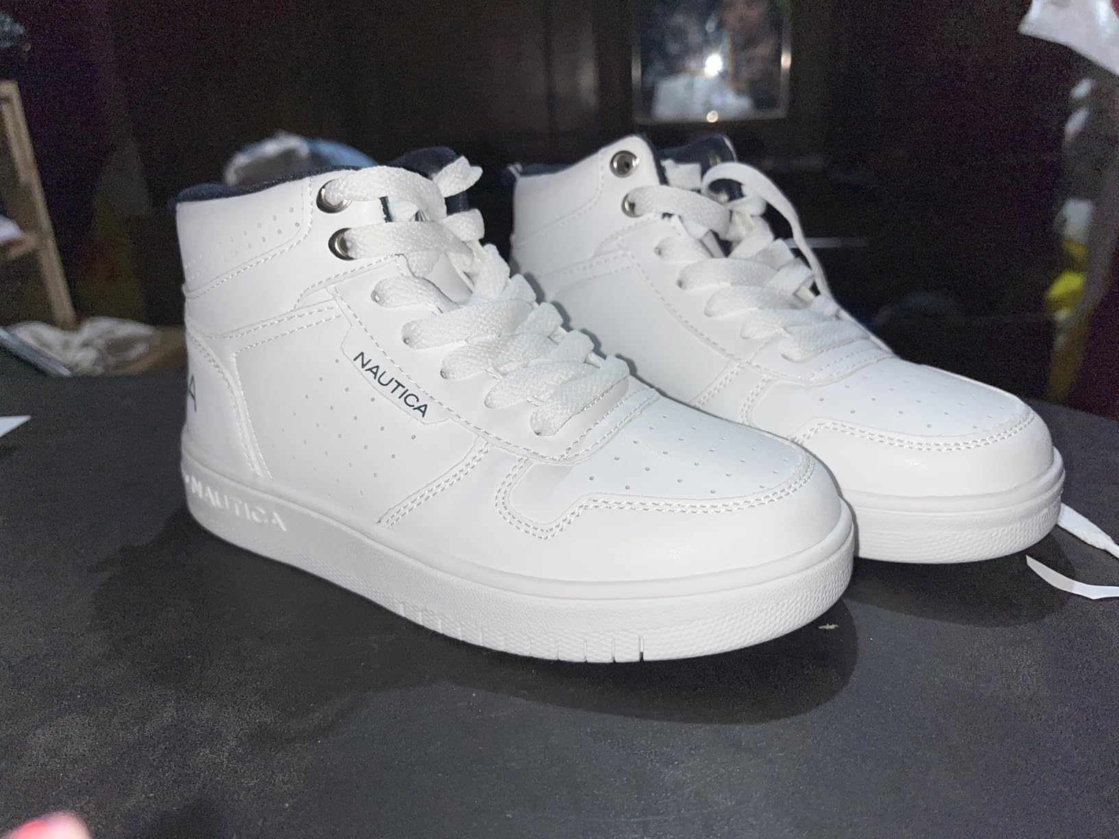 Side profile of Nautica Horizon kids sneakers displaying the boot-like high-top design and lacing system