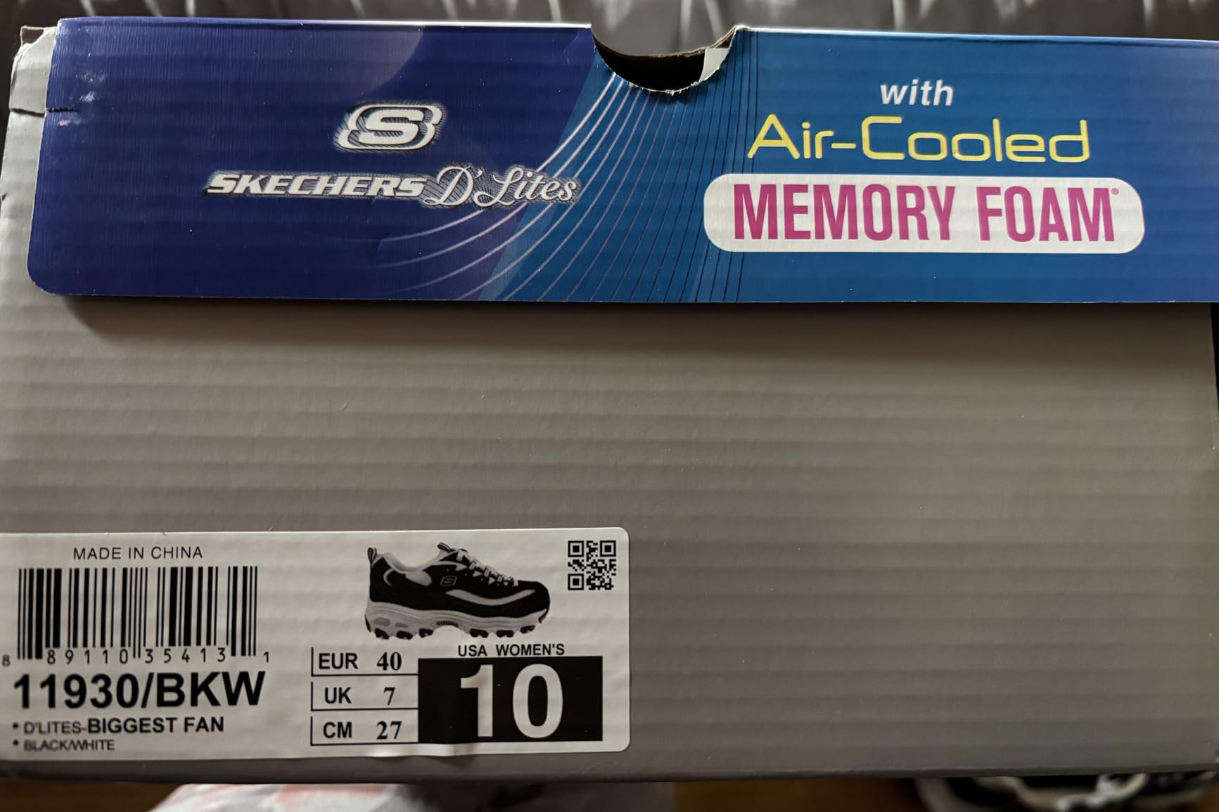 Close-up view of Skechers D'Lites showing leather and synthetic upper construction with lace-up closure system