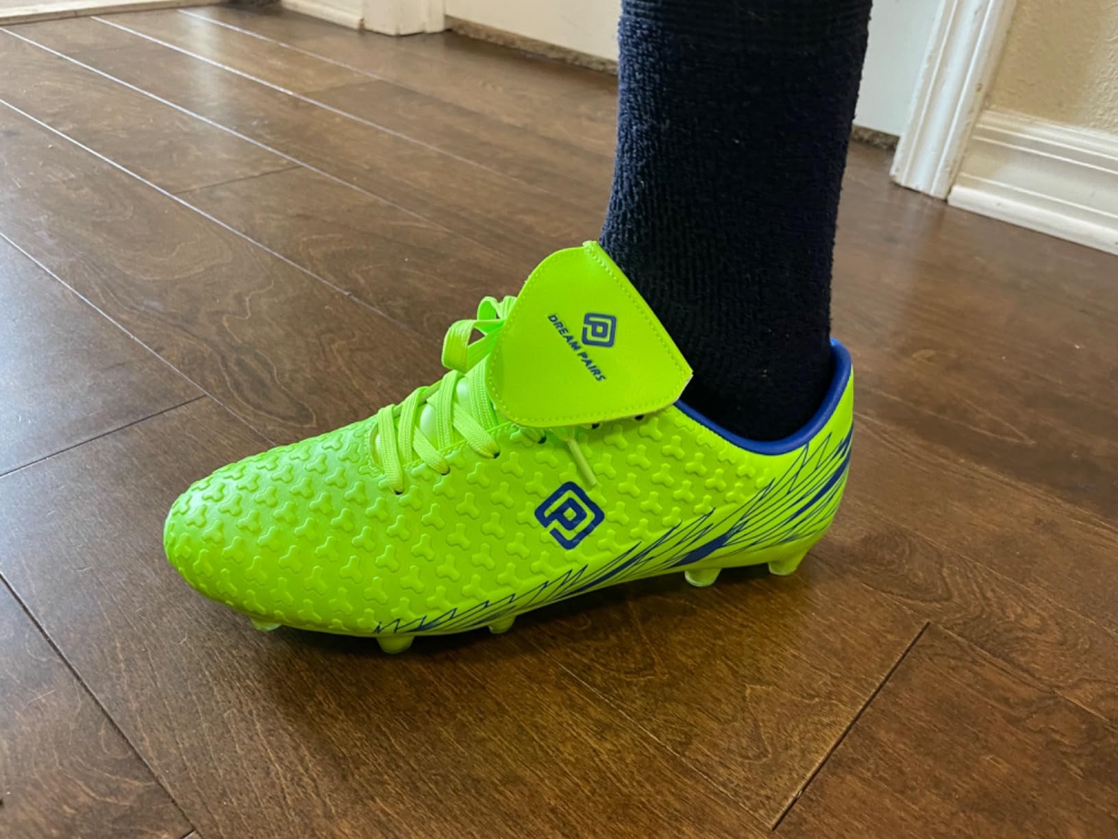 DREAM PAIRS soccer cleats action shot showing performance during gameplay