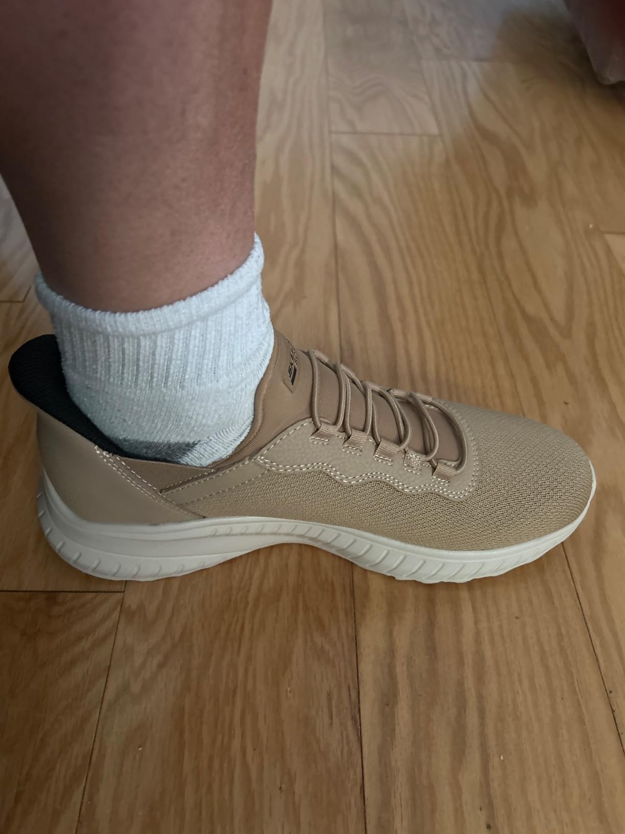 Lifestyle view of Skechers slip-ins showing casual wear versatility and style