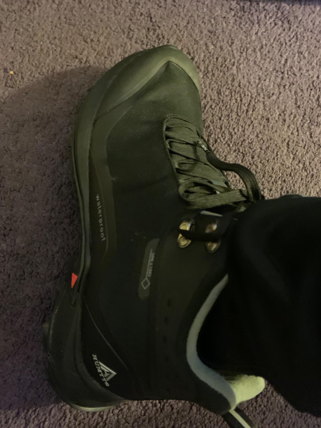 HUMTTO hiking boots being used for work applications showing durability and protection features