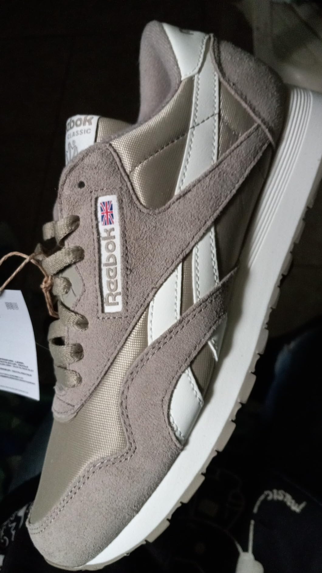 Detail shot of Reebok Classic heel area and side branding showing construction quality