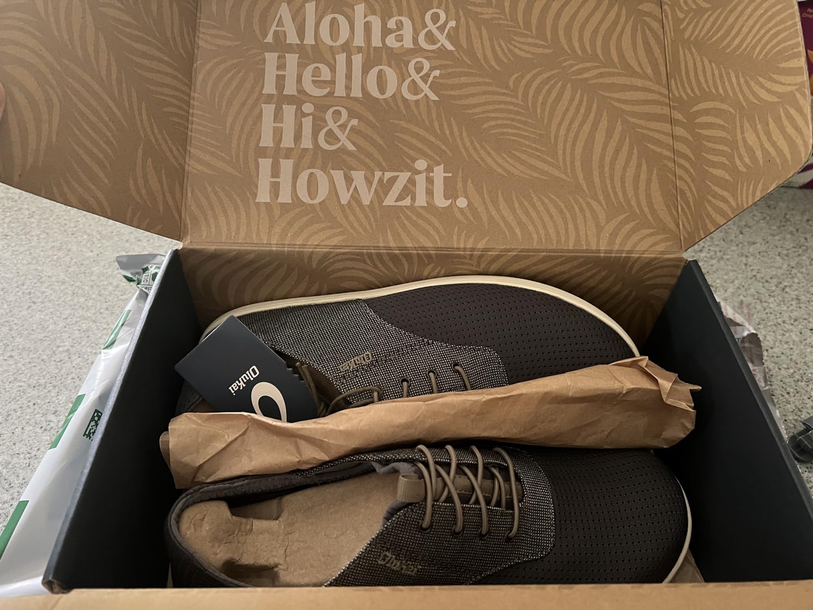 OLUKAI brand and construction quality showing premium materials and Hawaiian-inspired design philosophy