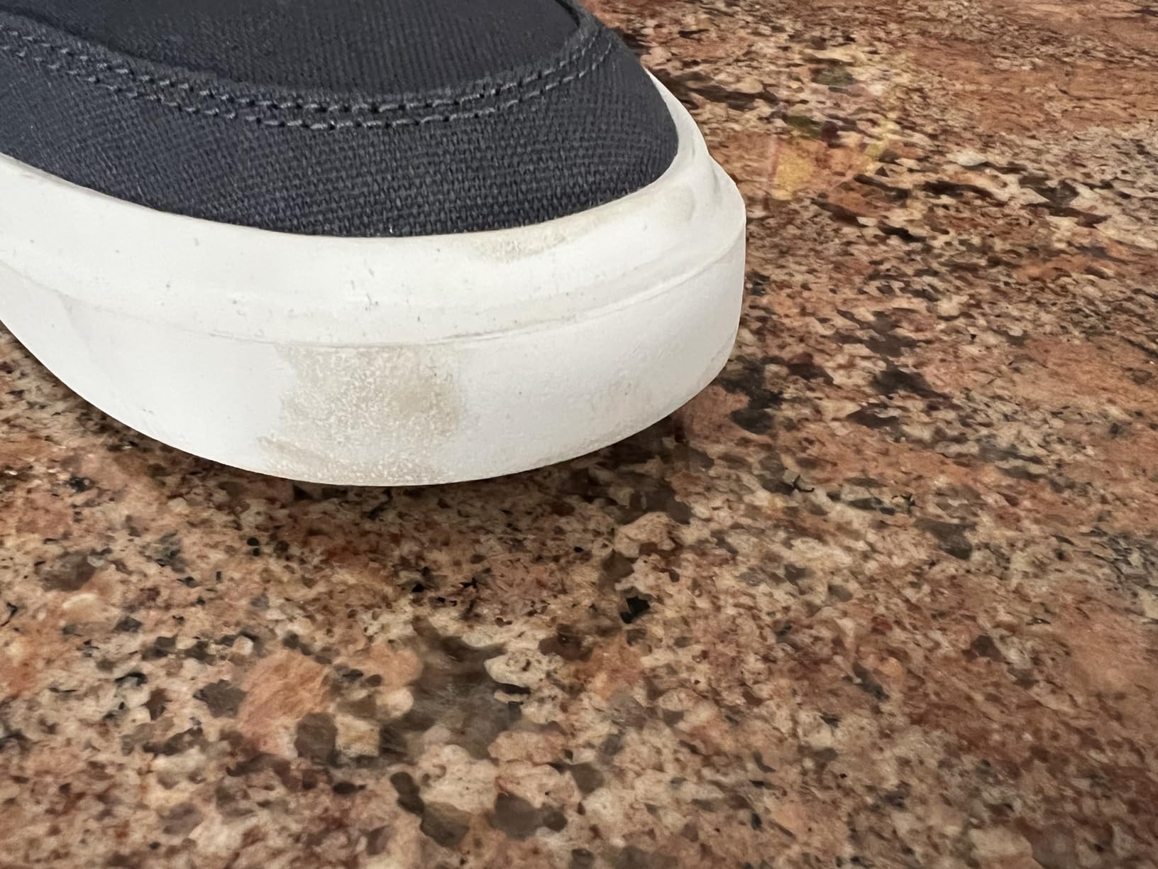 Cole Haan GrandPro Rally side profile showing EVA cupsole and canvas upper design details