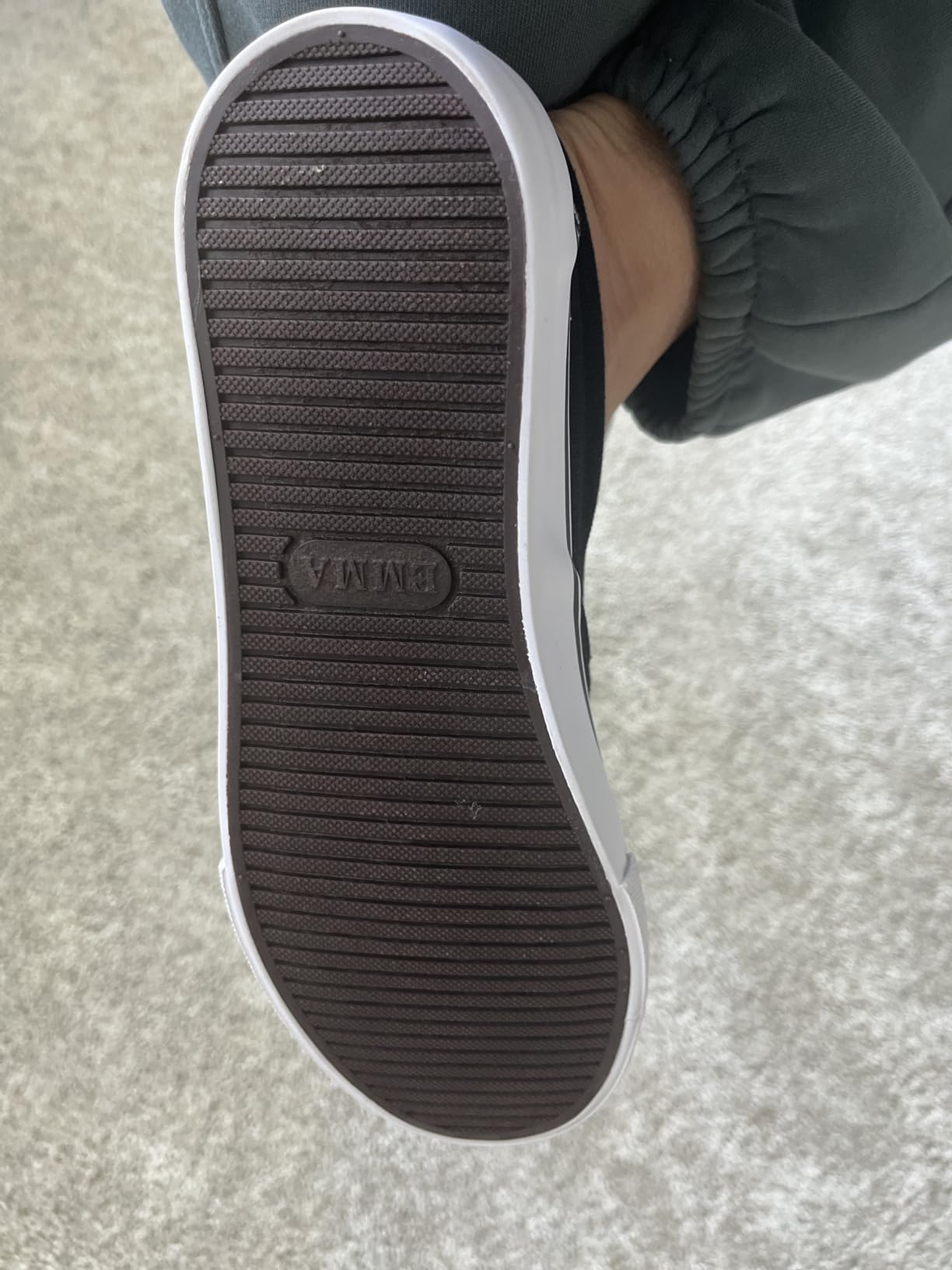 Side profile view showing flat sole design and minimal arch support structure