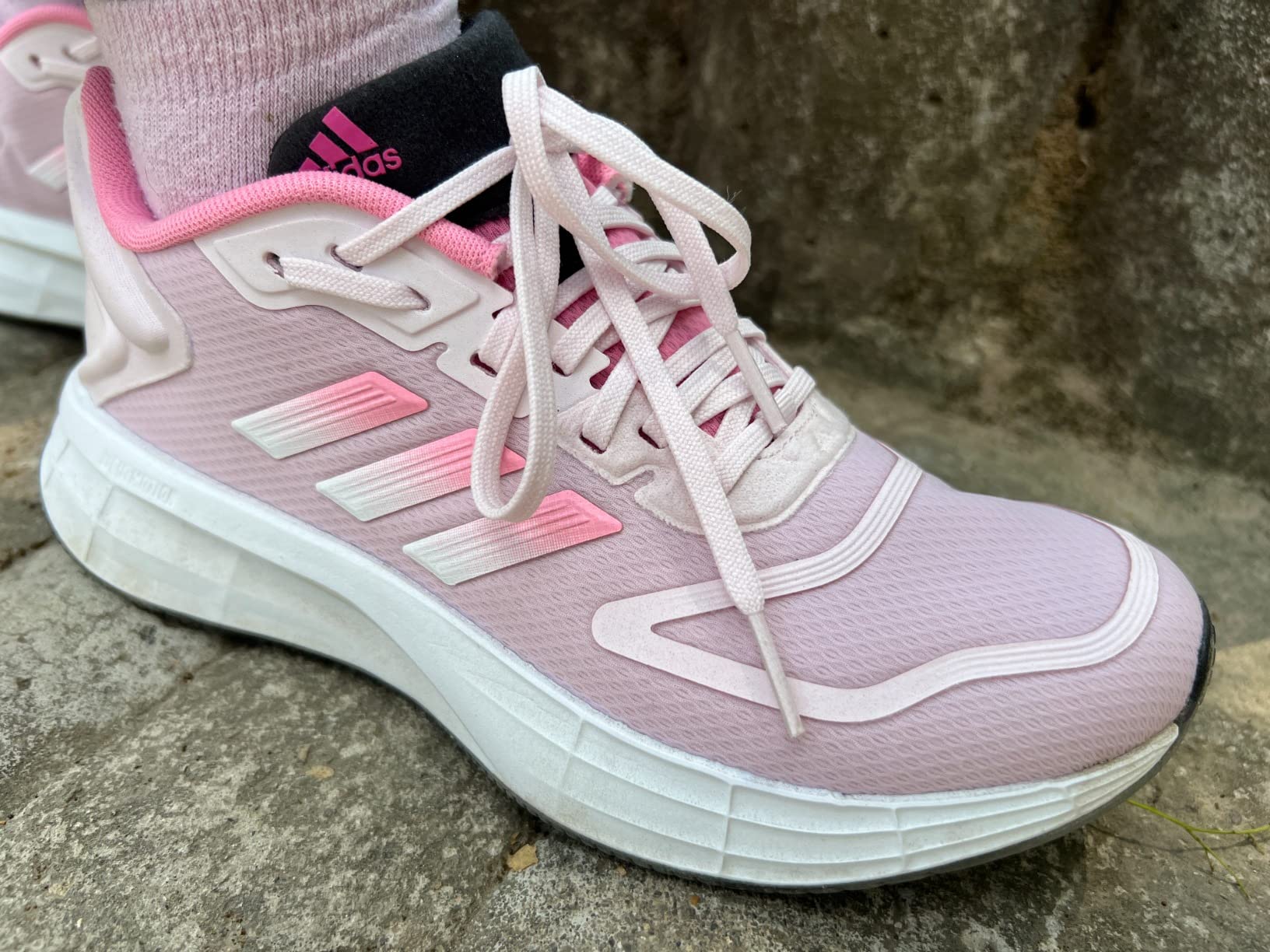 Adidas Duramo SL 2.0 in action during outdoor running session showing versatility for different activities