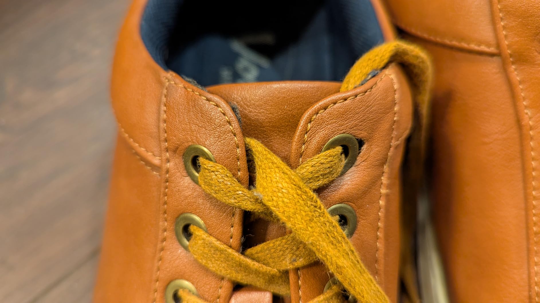 Vostey sneaker showing early wear signs with eyelet separation issue after 2 months office use