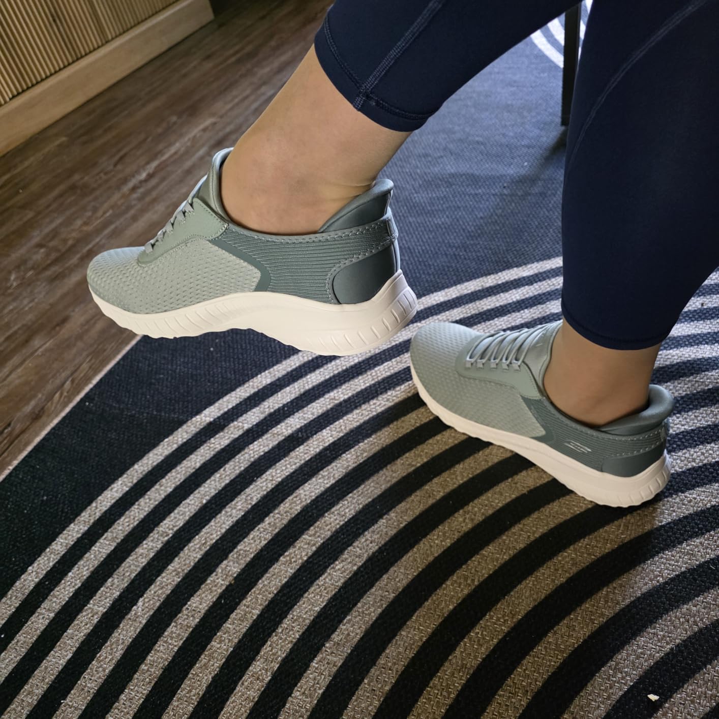 Close-up of Skechers slip-in design showing engineered knit upper and stretch laces