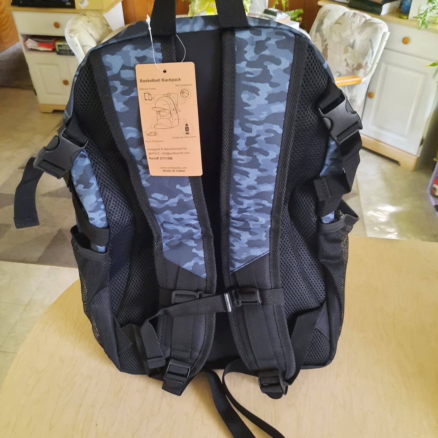 WOLT Basketball Backpack shoe compartment detail showing ventilation and storage capacity