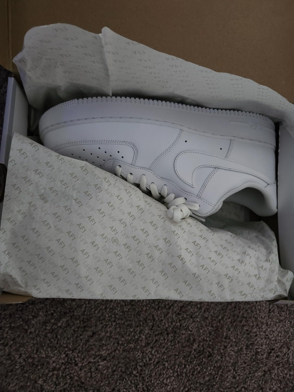 Nike Air Force 1 in original Nike box showing authentic packaging and presentation