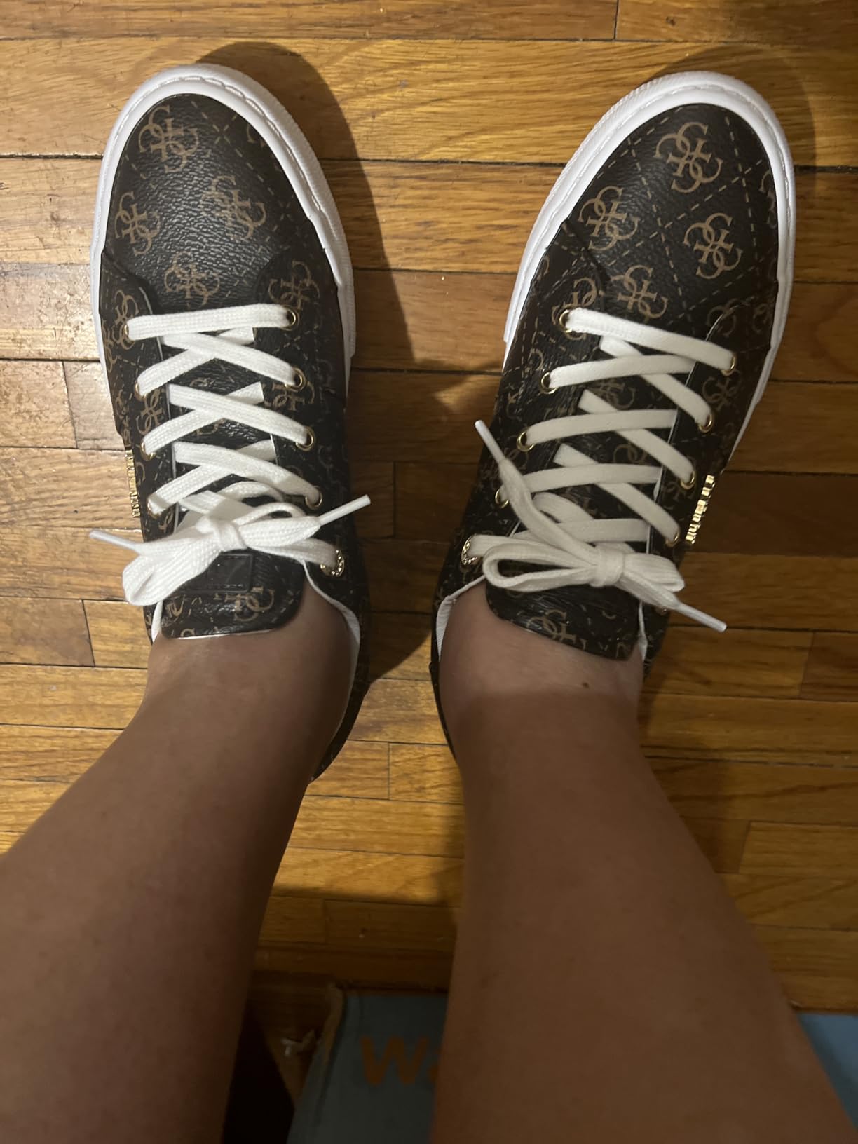 GUESS Women's Loven Sneaker showing different color options and versatility