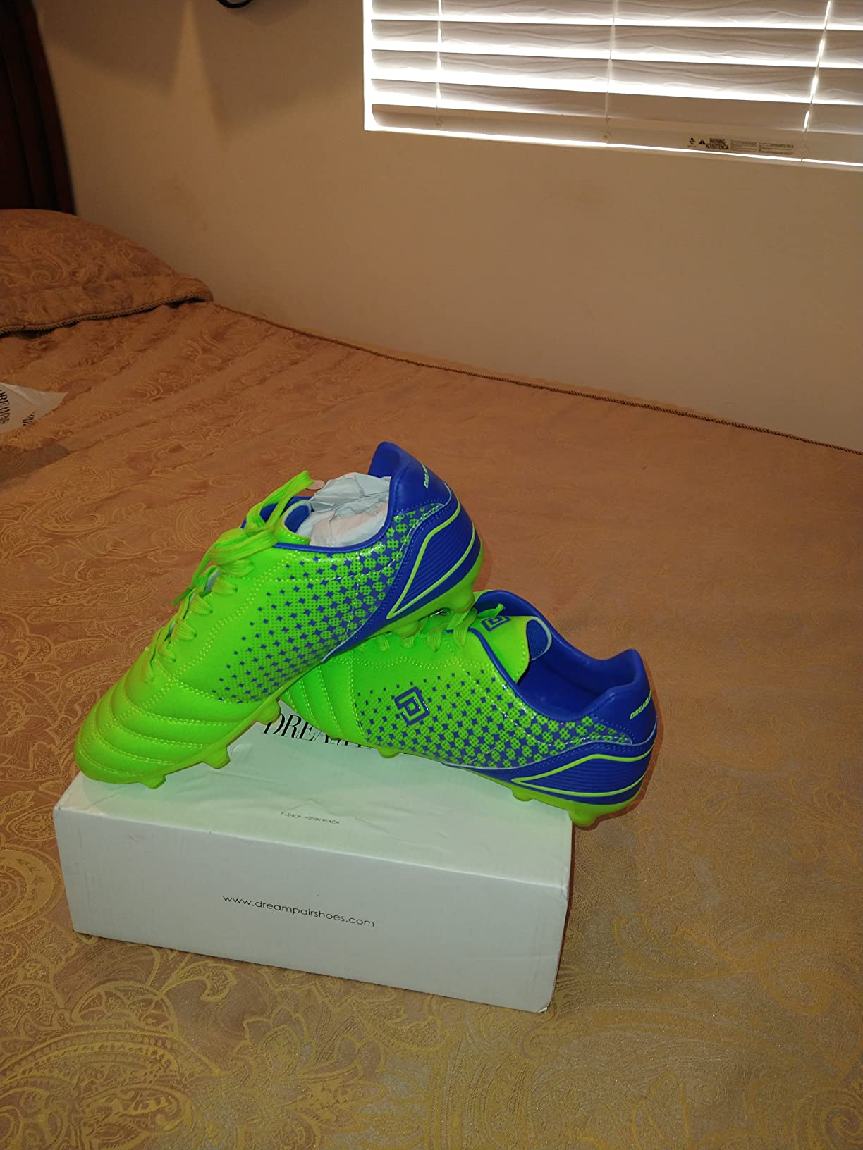 DREAM PAIRS cleats in packaging showing product presentation and quality expectations