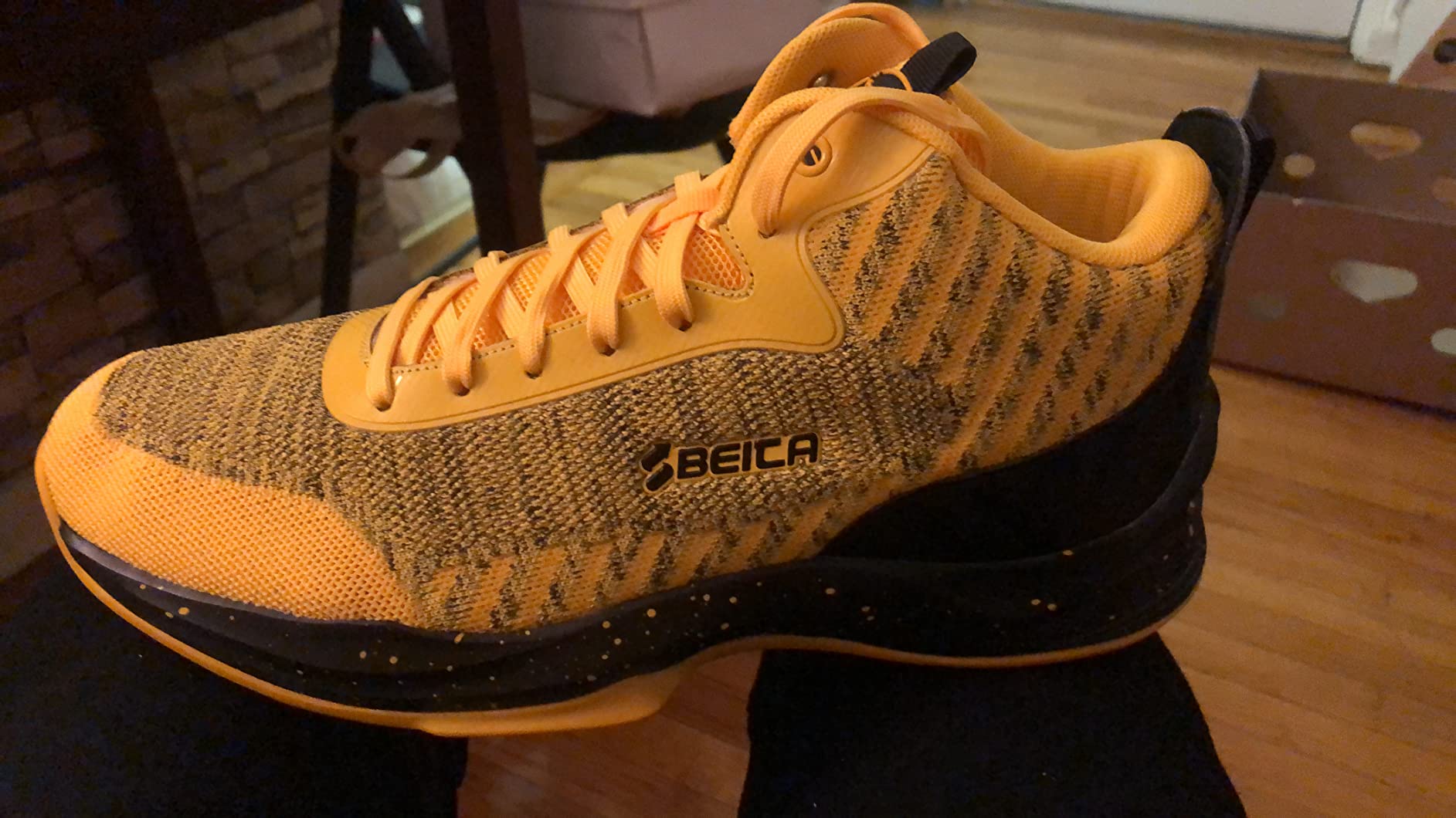 Side view of Beita basketball shoes showing support structure and design elements
