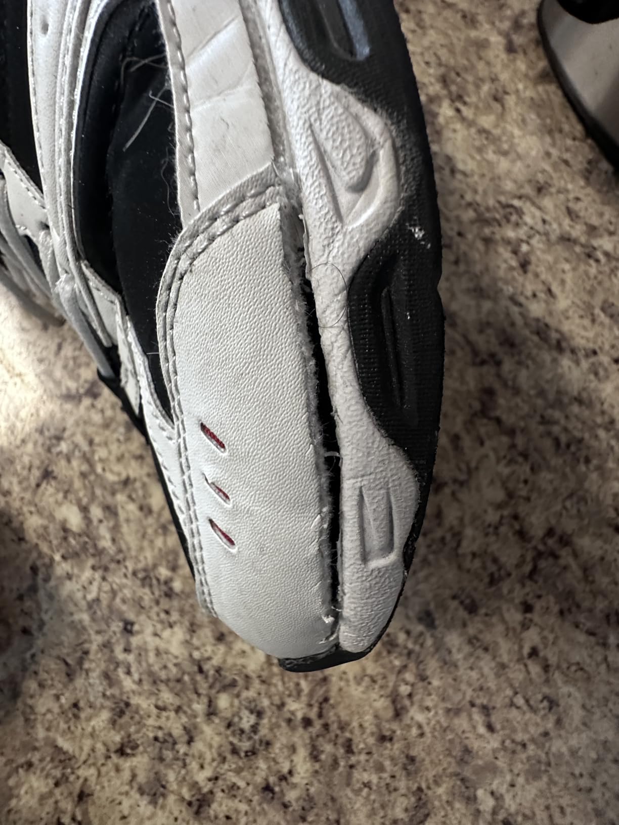 Bottom view of Avia shoe showing significant sole wear and deterioration