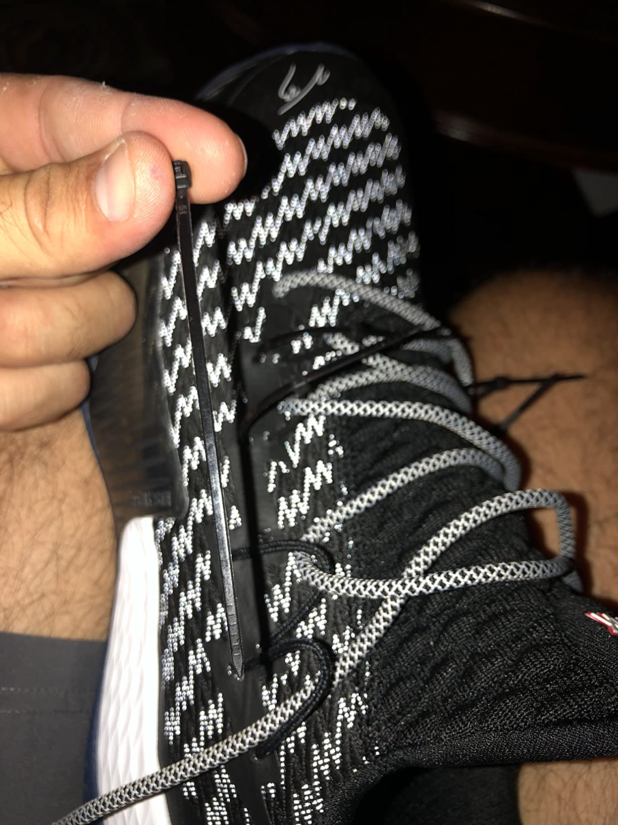 Basketball shoe lacing system failure showing broken eyelet and compromised fit
