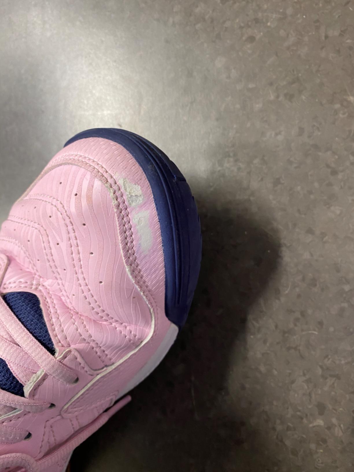 ASICS Gel-Dedicate 6 showing wear patterns after extended use including pink color fading and ventilation holes