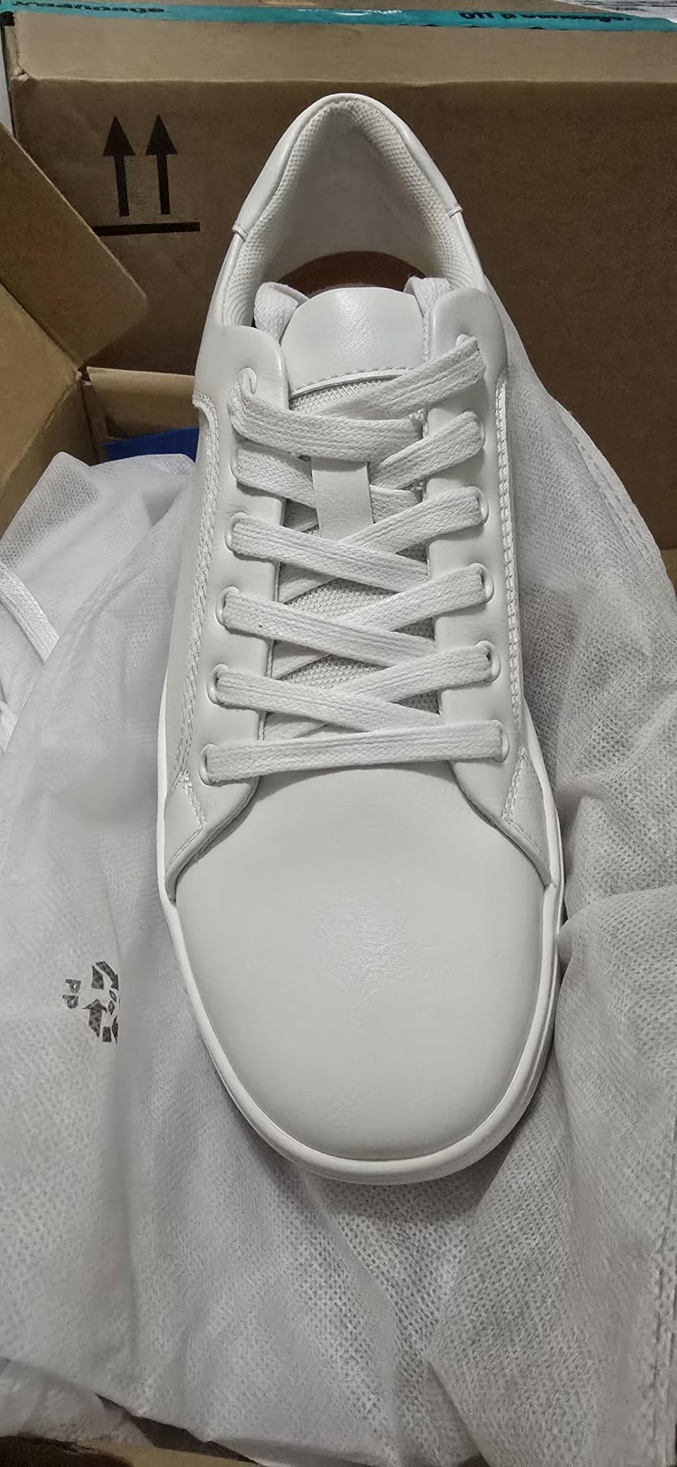 Bruno Marc sneakers detail shot showing lace-up design and padded collar construction