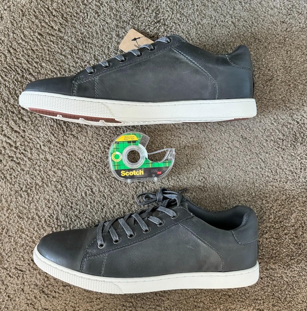 Real world color comparison showing Jousen sneakers actual tan shade versus expected color with reference tape