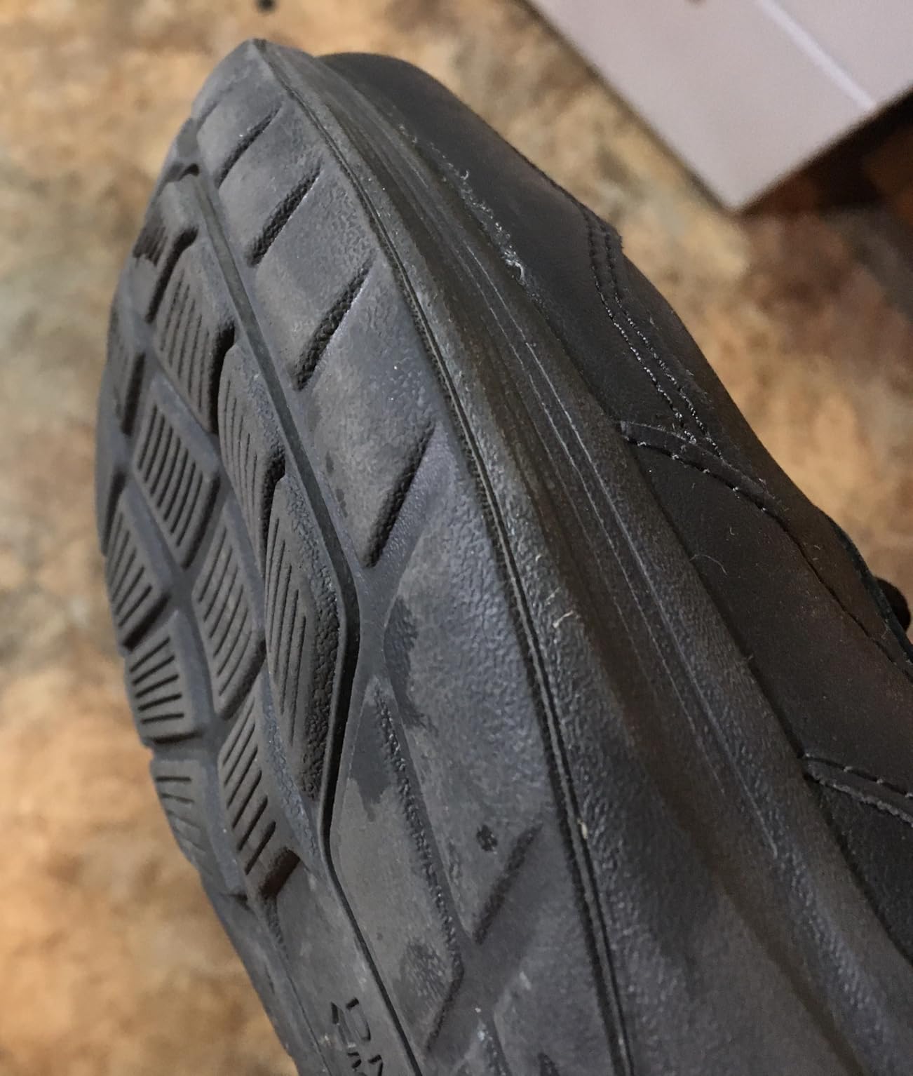 Bottom sole view showing worn DMX air technology and collapsed heel chamber in used Reebok walking shoe
