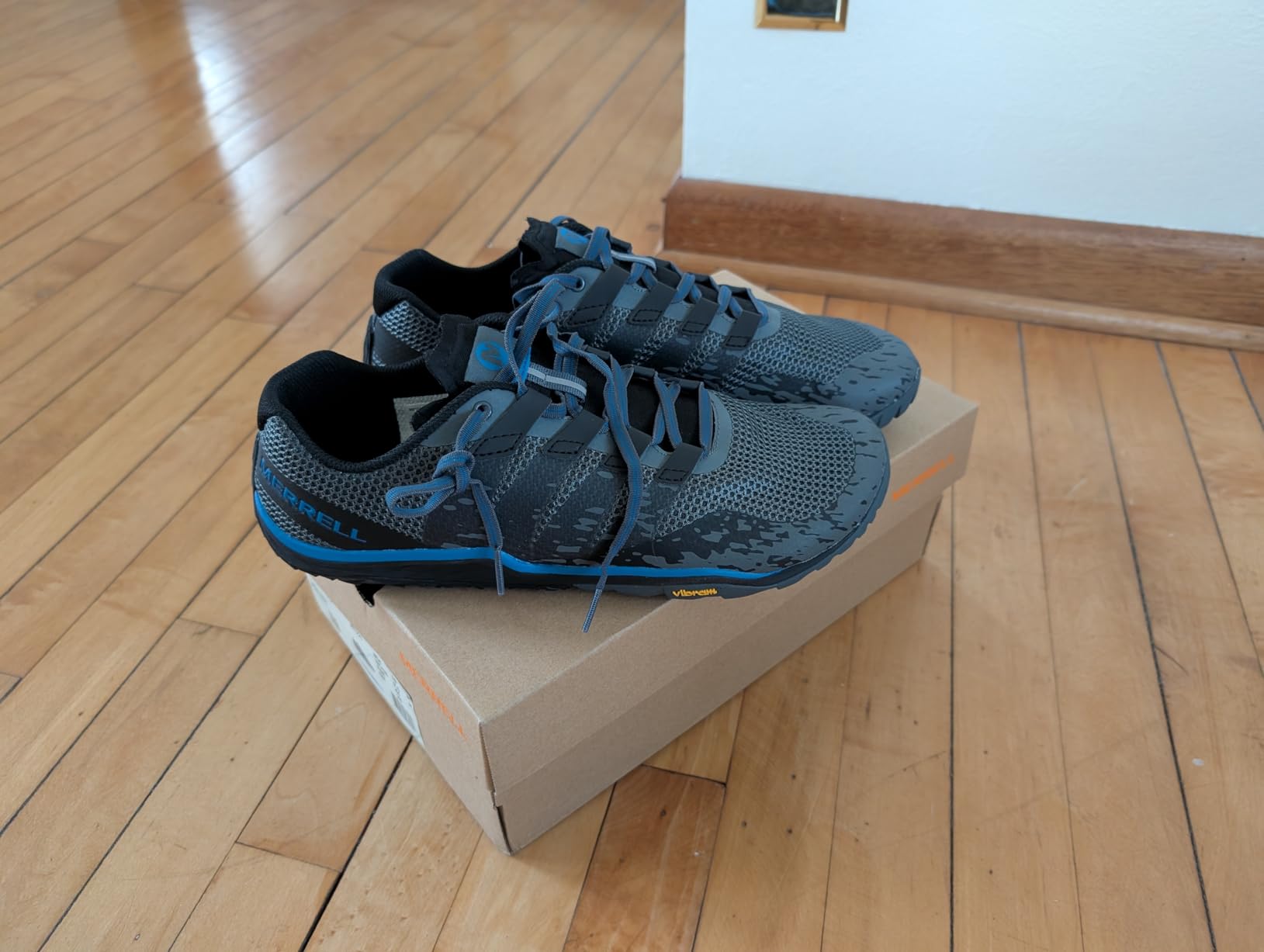 Merrell Trail Glove 5 black colorway showing minimalist design and Vibram sole
