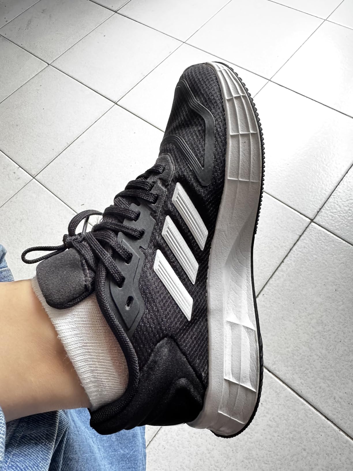 Side profile view of Adidas Duramo SL 2.0 showing LIGHTMOTION midsole and rubber outsole traction pattern