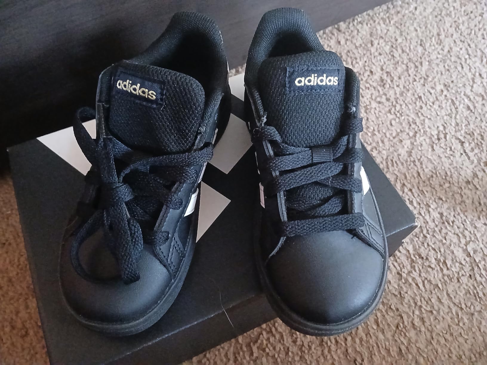 Adidas Grand Court 2.0 kids sneakers during playground use showing durability and real-world performance