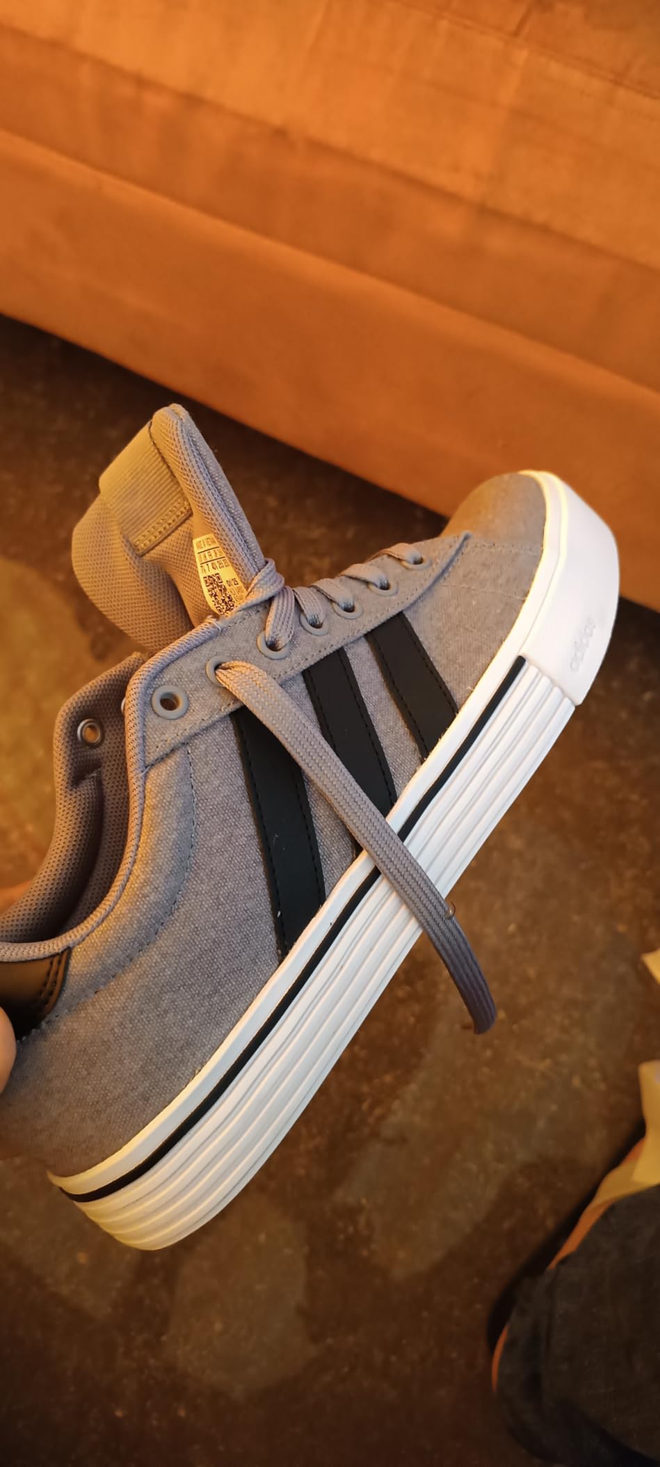Adidas Daily 4.0 sneakers grey black white colorway showing classic three stripes design