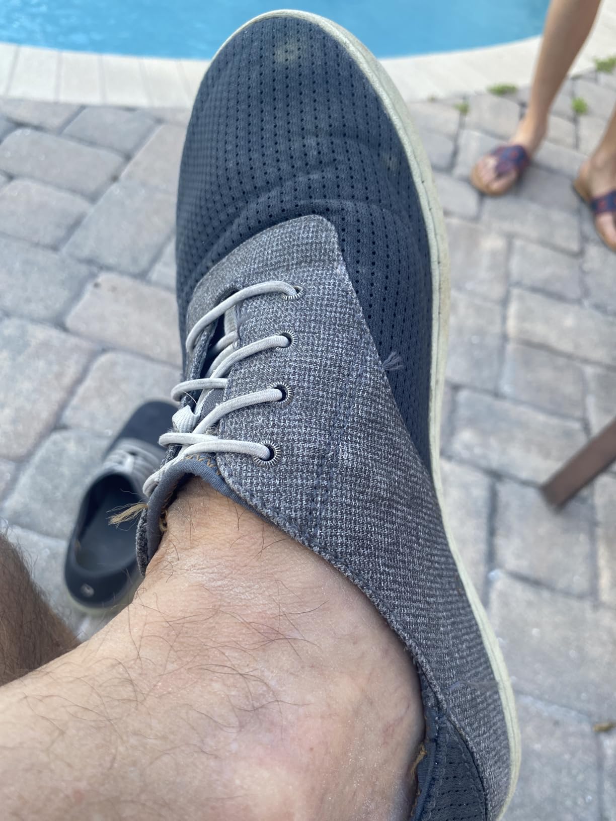 OLUKAI Nohea Moku mens boat shoes charcoal clay colorway showing no-tie elastic laces and mesh upper construction