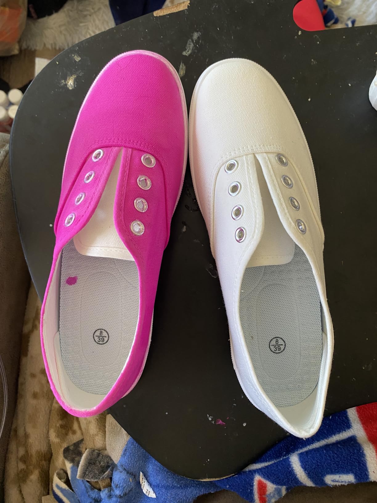 Pair of TUOPIN sneakers on outdoor surface demonstrating real-world wear scenario