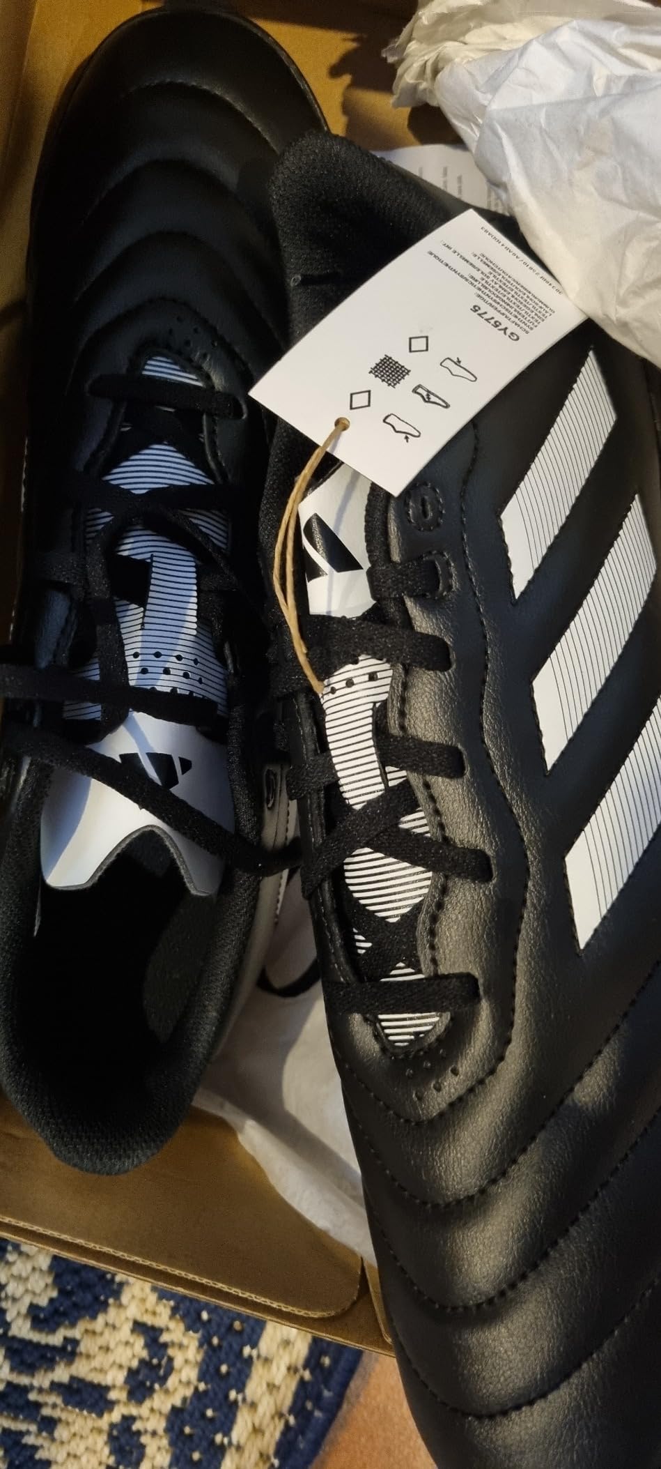 adidas Goletto VIII turf soccer shoes black with white stripes showing synthetic upper and rubber turf outsole