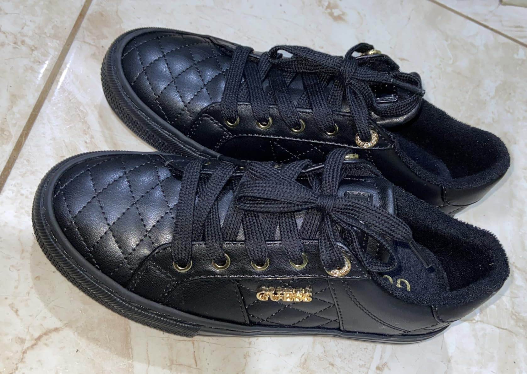 GUESS Women's Loven Sneaker interior view showing cushioned footbed and fabric lining