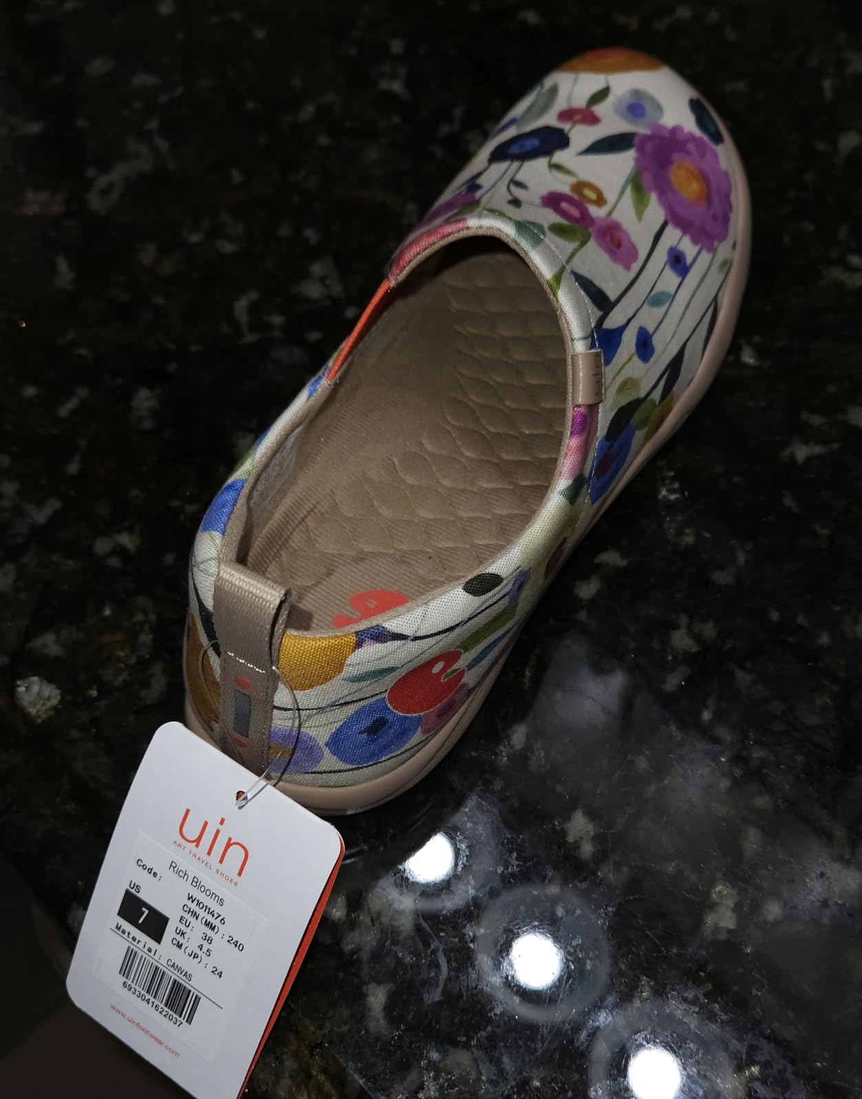 UIN Women's Blossom slip-on shoes showing vibrant floral artwork design and canvas construction