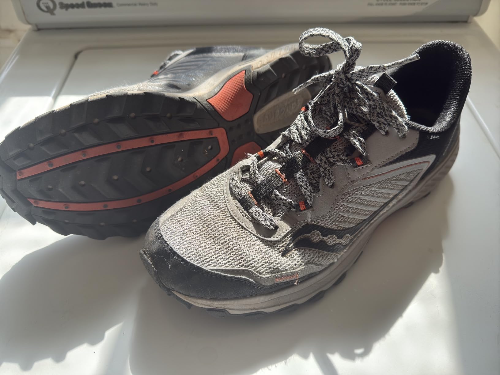 Saucony Men's Excursion TR15 trail running shoes showing gray and black colorway with aggressive lugged outsole