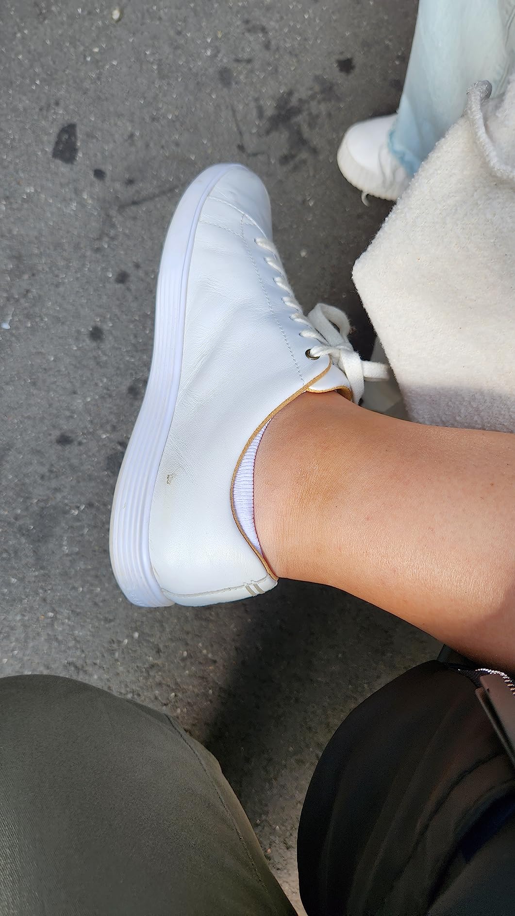 Cole Haan sneakers being worn during European travel showing versatility with different outfits